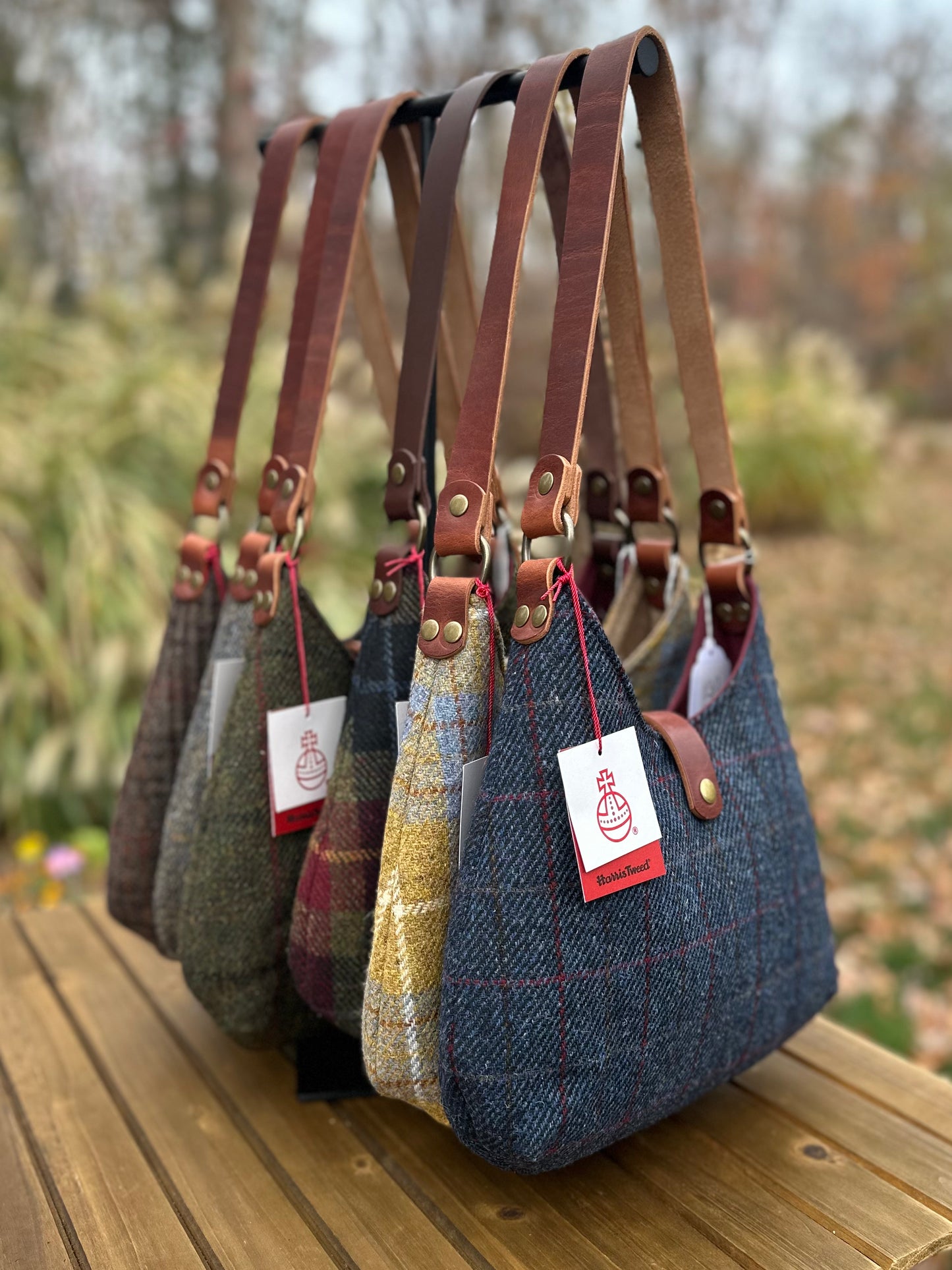 Harris Tweed® Rhode River Shoulder Bags six bags, with different prints and leather combos paired with Antique Brass Hardware. Handcrafted in Maryland