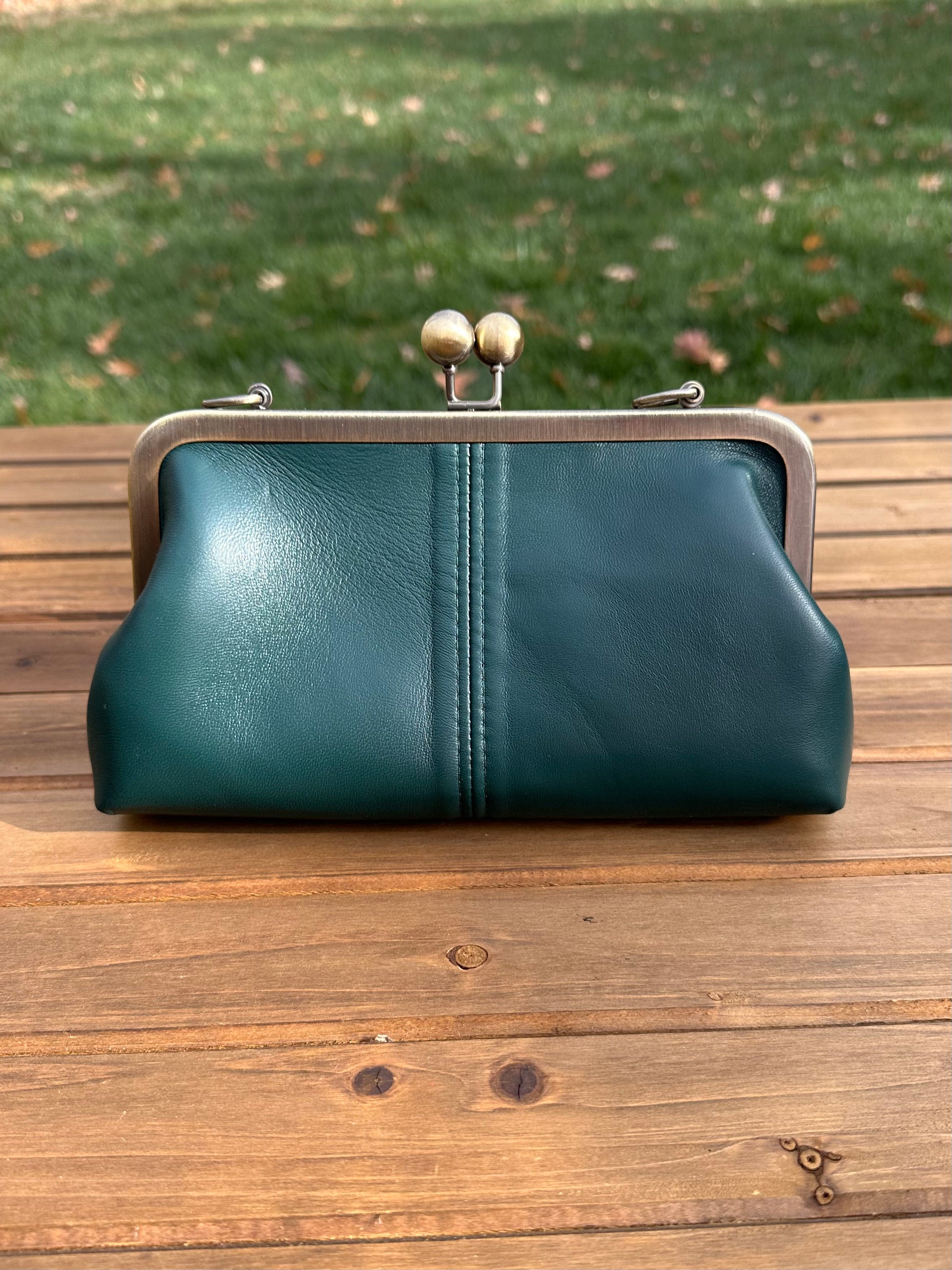 Nappa Forest Green Leather kiss lock purse with bronze hardware. Wear as a clutch, crossbody, or shoulder bag. Holds phone, cards, and essentials.  Made in Maryland.