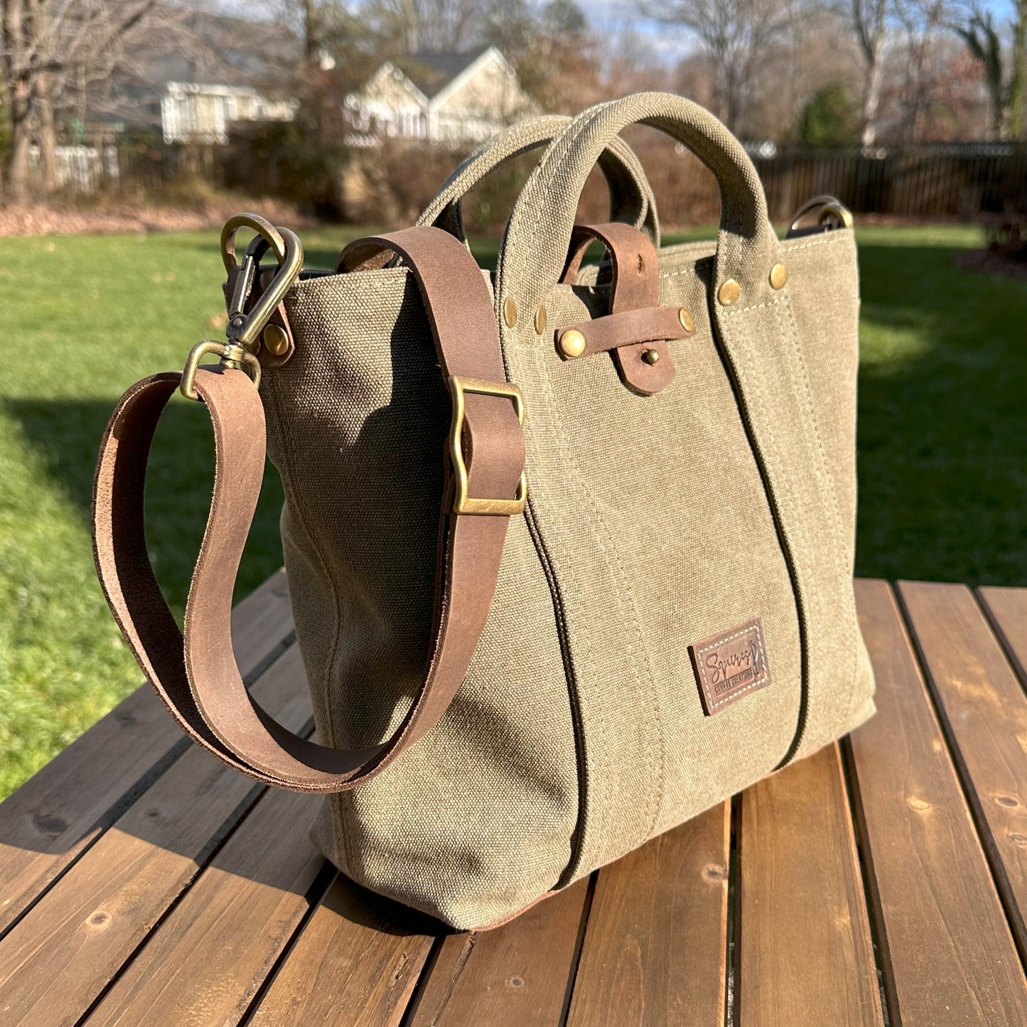 Olive Drab Stone Washed Canvas and Crazy Horse Tan leather with Antique Brass Rivets Waterman Crossbody Tote squirescanvascreations.com