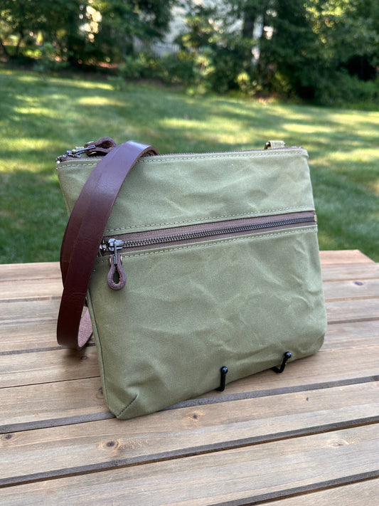 Front View Handcrafted Canvas Bayside Slim Crossbody Bag in Fieldbean Hybrid waxed canvas with cotton canvas lining and adjustable Splenda vegetable-tanned leather strap. Lightweight and perfect for everyday wear.