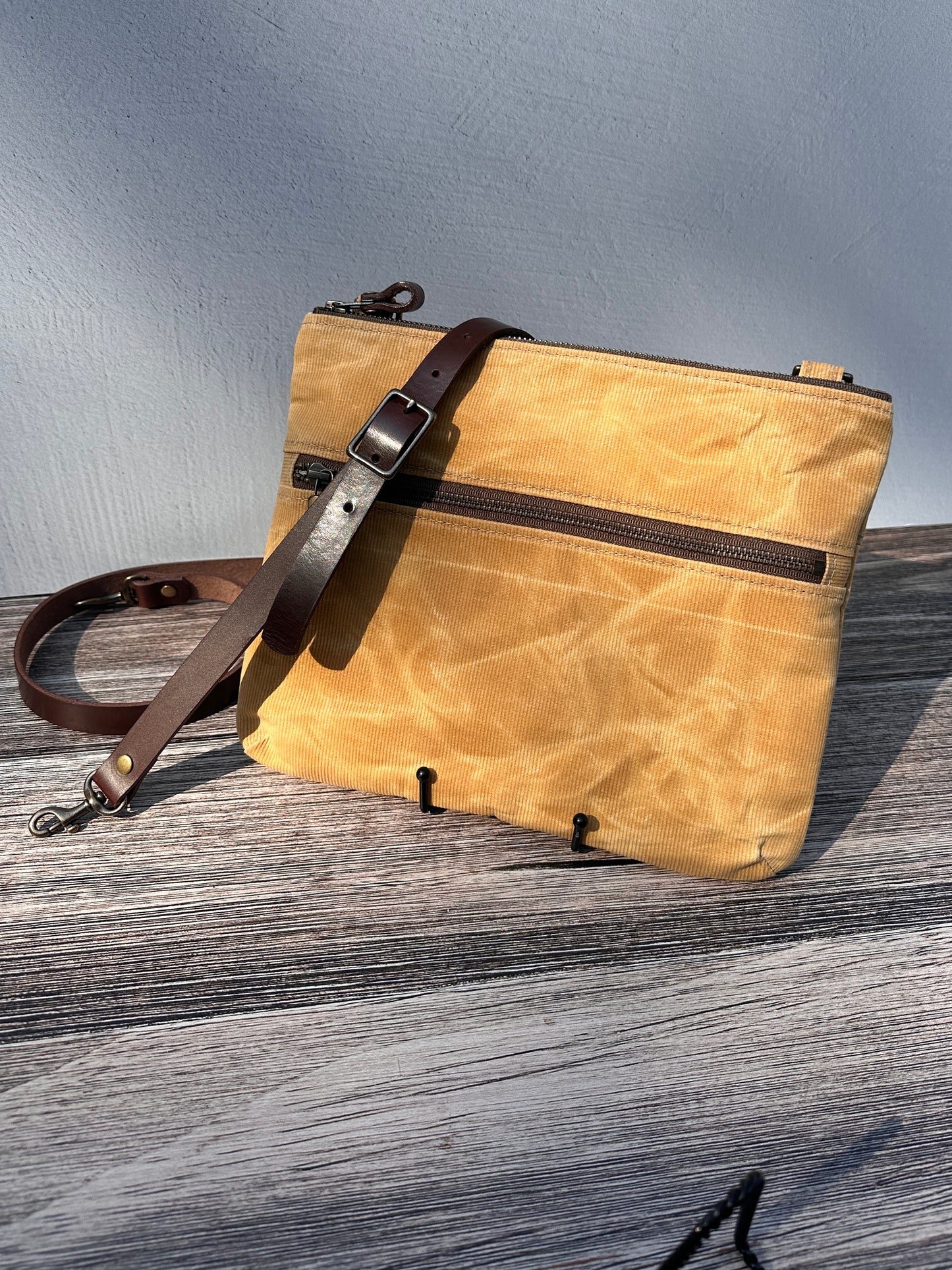 Front View Handcrafted Canvas Bayside Slim Crossbody Bag in Honey Waxed Corduroy with cotton canvas lining and adjustable Splenda vegetable-tanned leather strap. Lightweight and perfect for everyday wear.