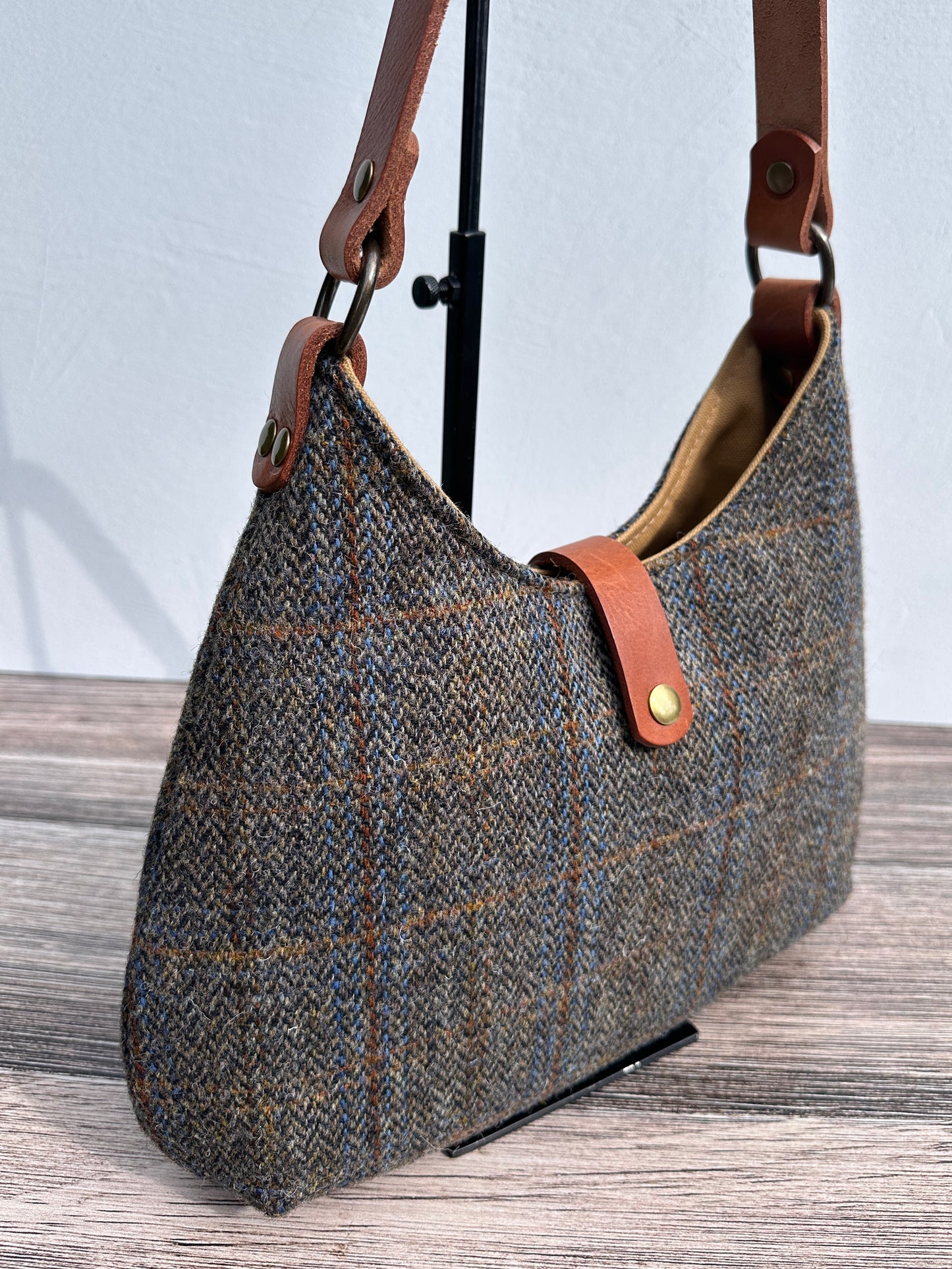 Up Close view Green & Blue Herringbone Harris Tweed® Rhode River Shoulder Bags, Cognac Leather with Antique Brass Hardware. Handcrafted in Maryland