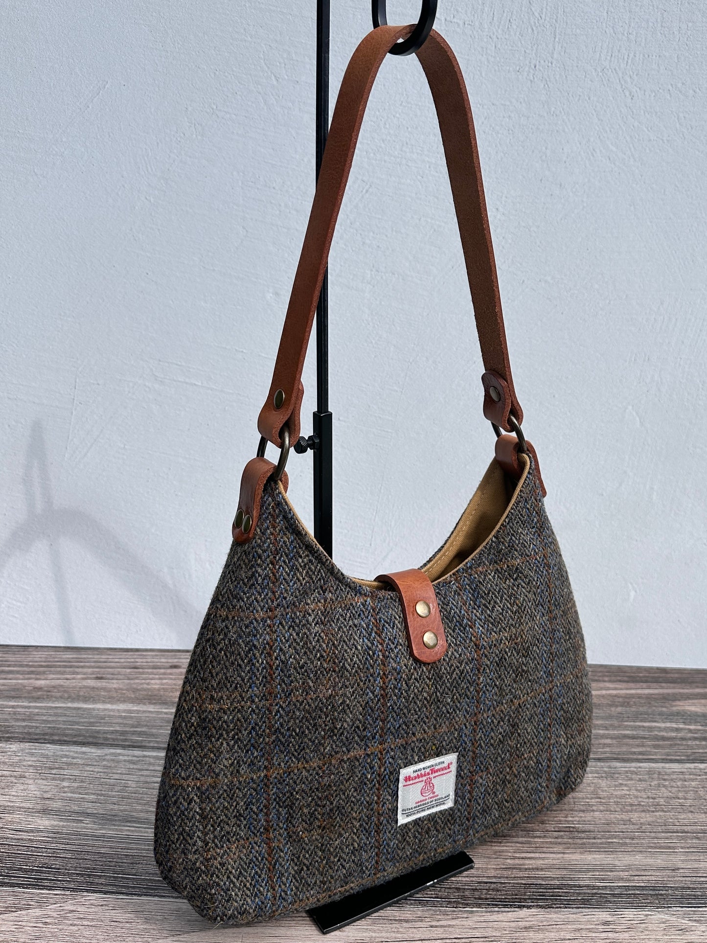 Back view Green & Blue Herringbone Harris Tweed® Rhode River Shoulder Bags, Cognac Leather with Antique Brass Hardware. Handcrafted in Maryland