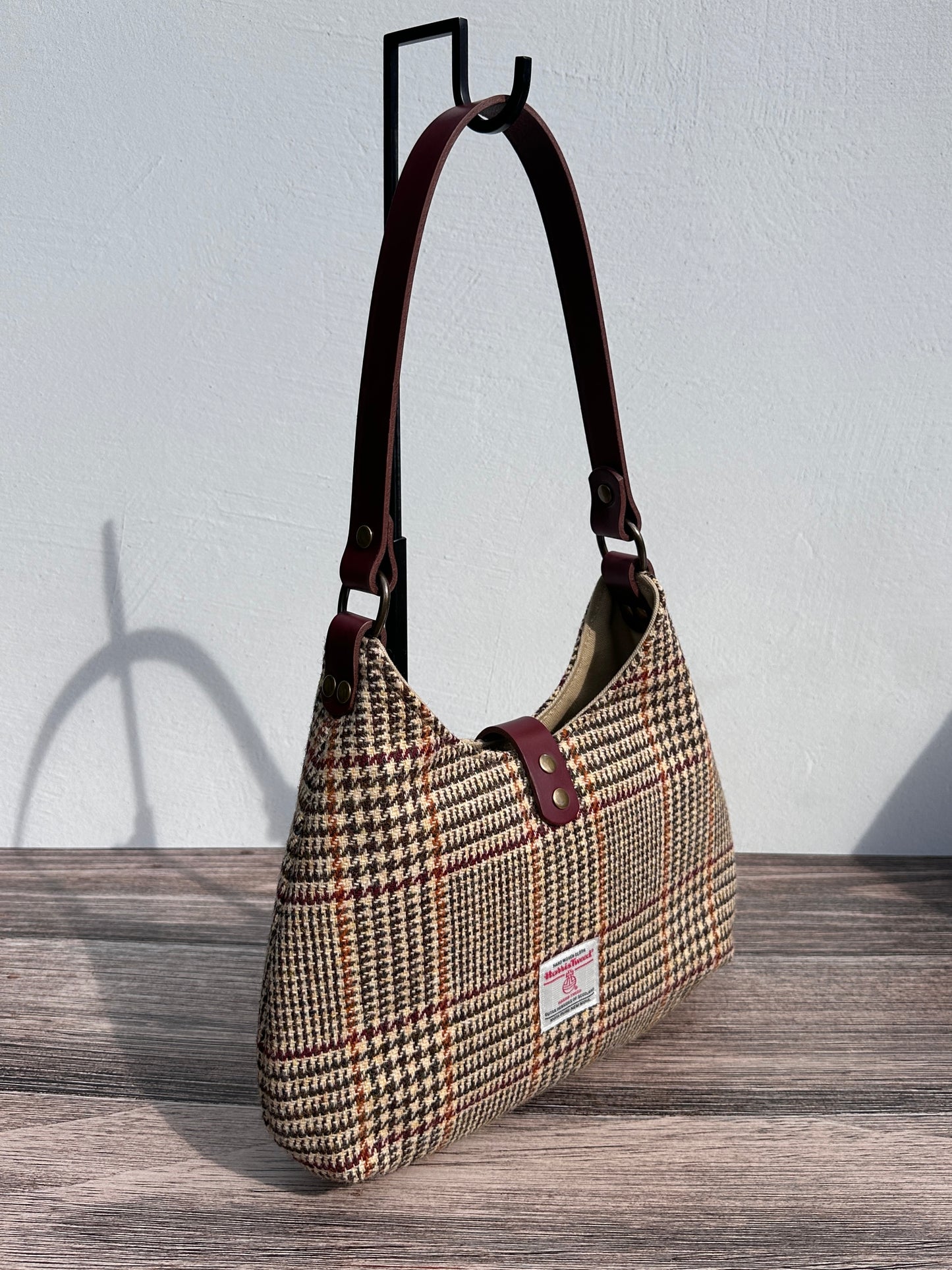 Back view Glen Plaid Harris Tweed® Rhode River Shoulder Bags, Bordeaux Leather with Antique Brass Hardware. Handcrafted in Maryland