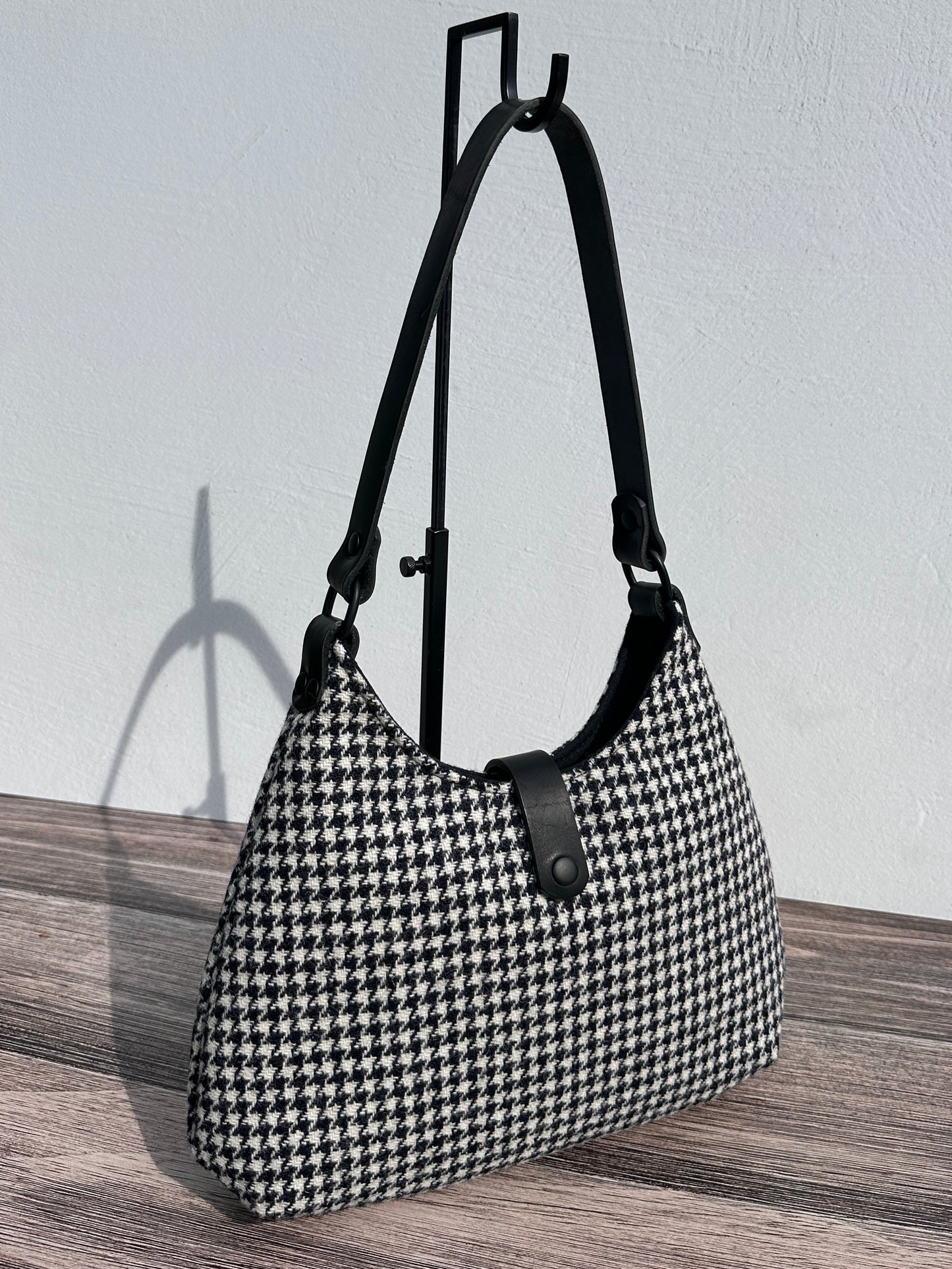 Front view Black and White Houndstooth Harris Tweed® Rhode River Shoulder Bags, Black Leather with Black Matte Hardware. Handcrafted in Maryland