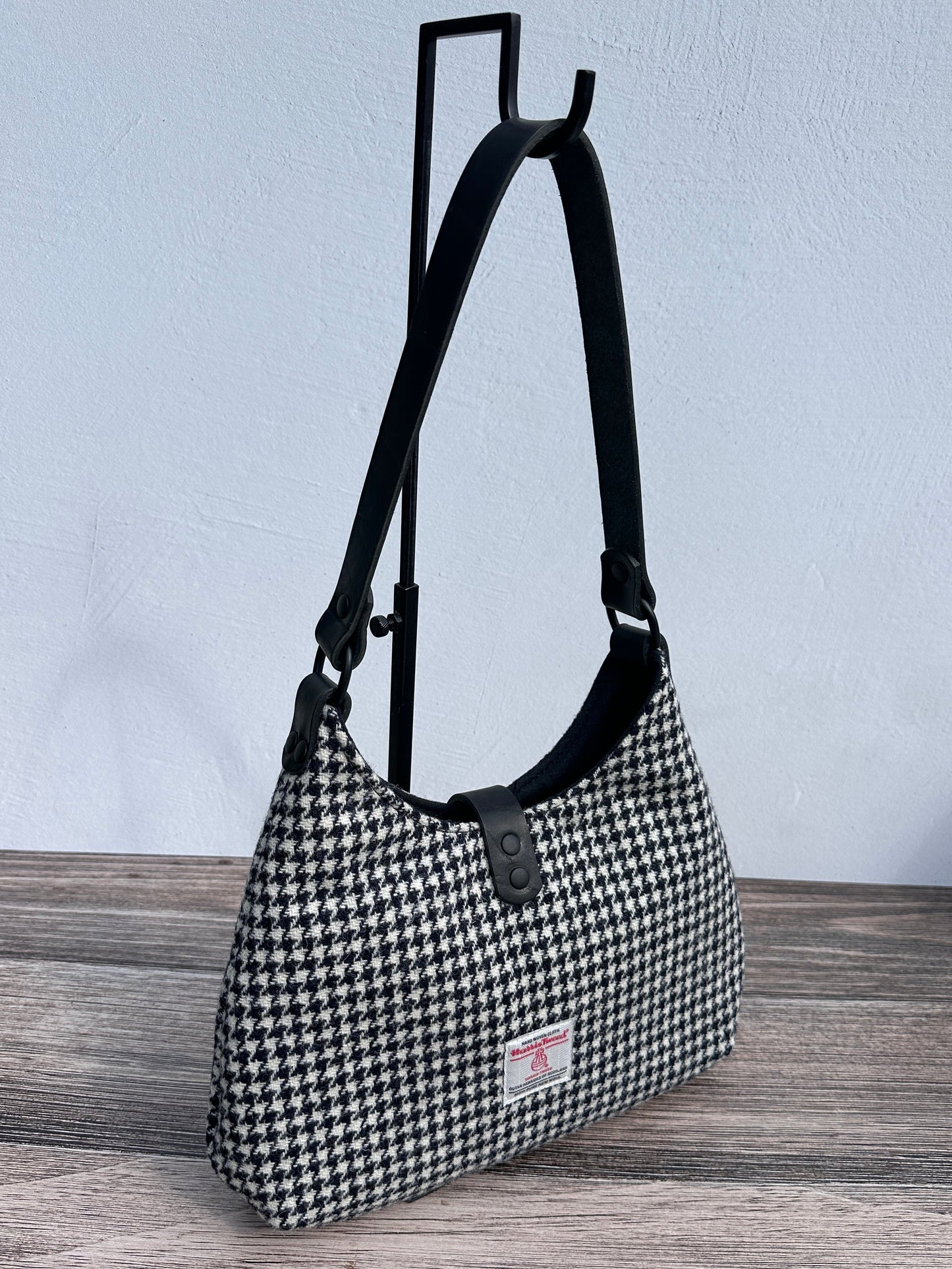 Back view Black and White Houndstooth Harris Tweed® Rhode River Shoulder Bags, Black Leather with Black Matte Hardware. Handcrafted in Maryland