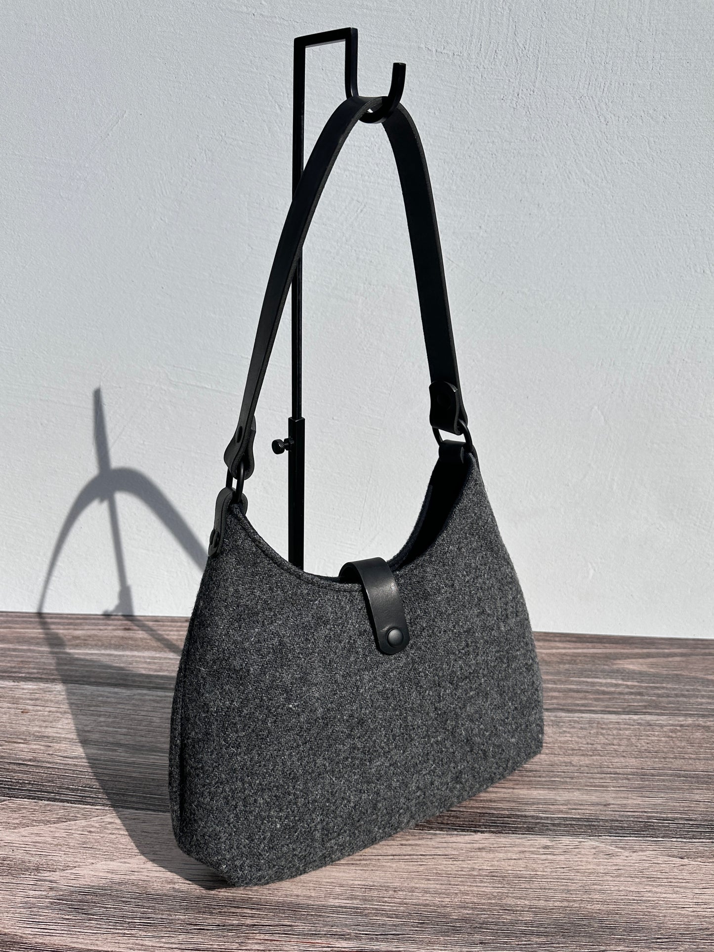 Front view Mid Grey Twill Harris Tweed® Rhode River Shoulder Bags, Black Leather with Black Matte Hardware. Handcrafted in Maryland