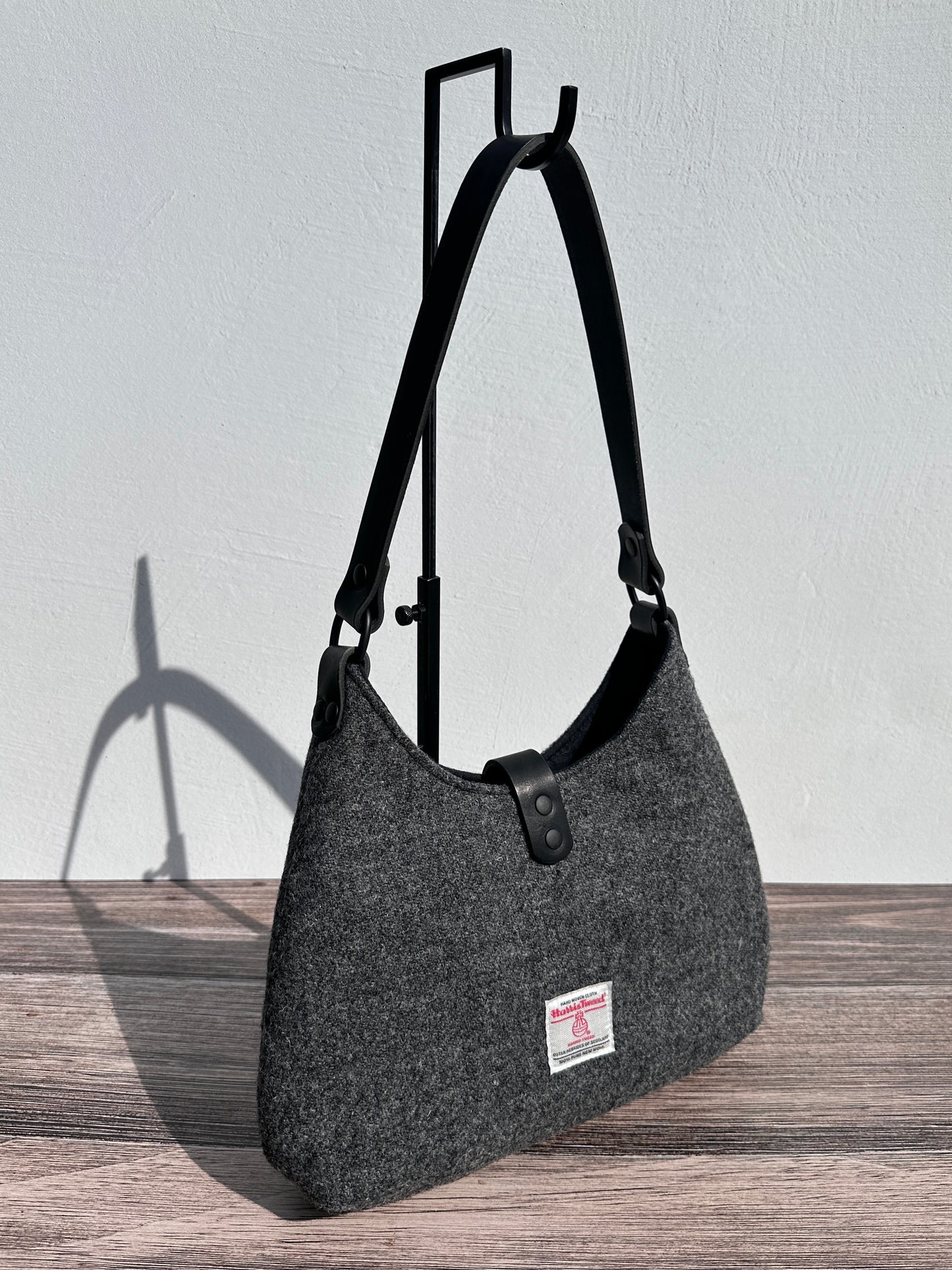 Back view Mid Grey Twill Harris Tweed® Rhode River Shoulder Bags, Black Leather with Black Matte Hardware. Handcrafted in Maryland