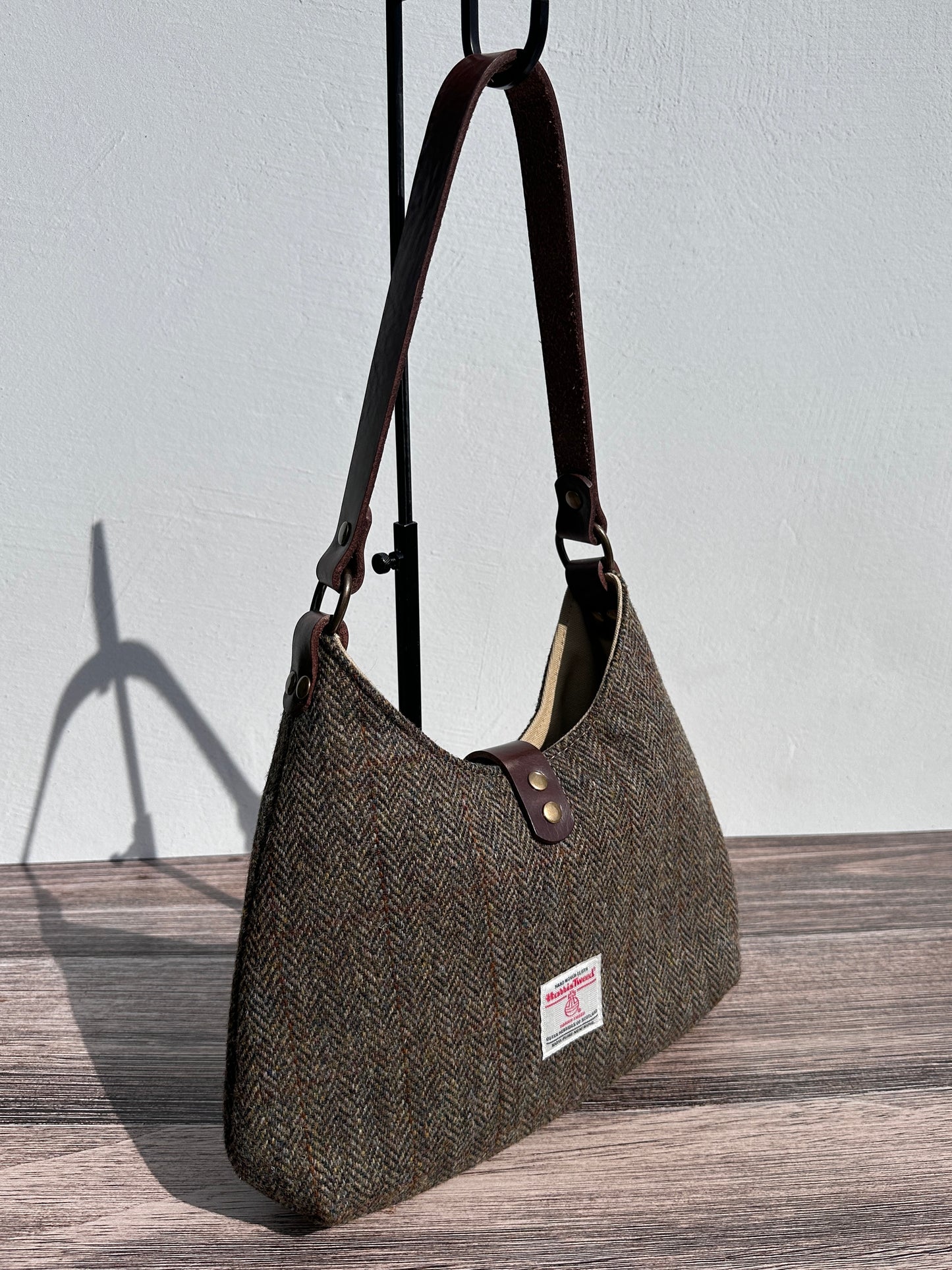 Back view Green and Brown Herringbone Harris Tweed® Rhode River Shoulder Bags, Dark Brown Leather with Antique Brass Hardware. Handcrafted in Maryland