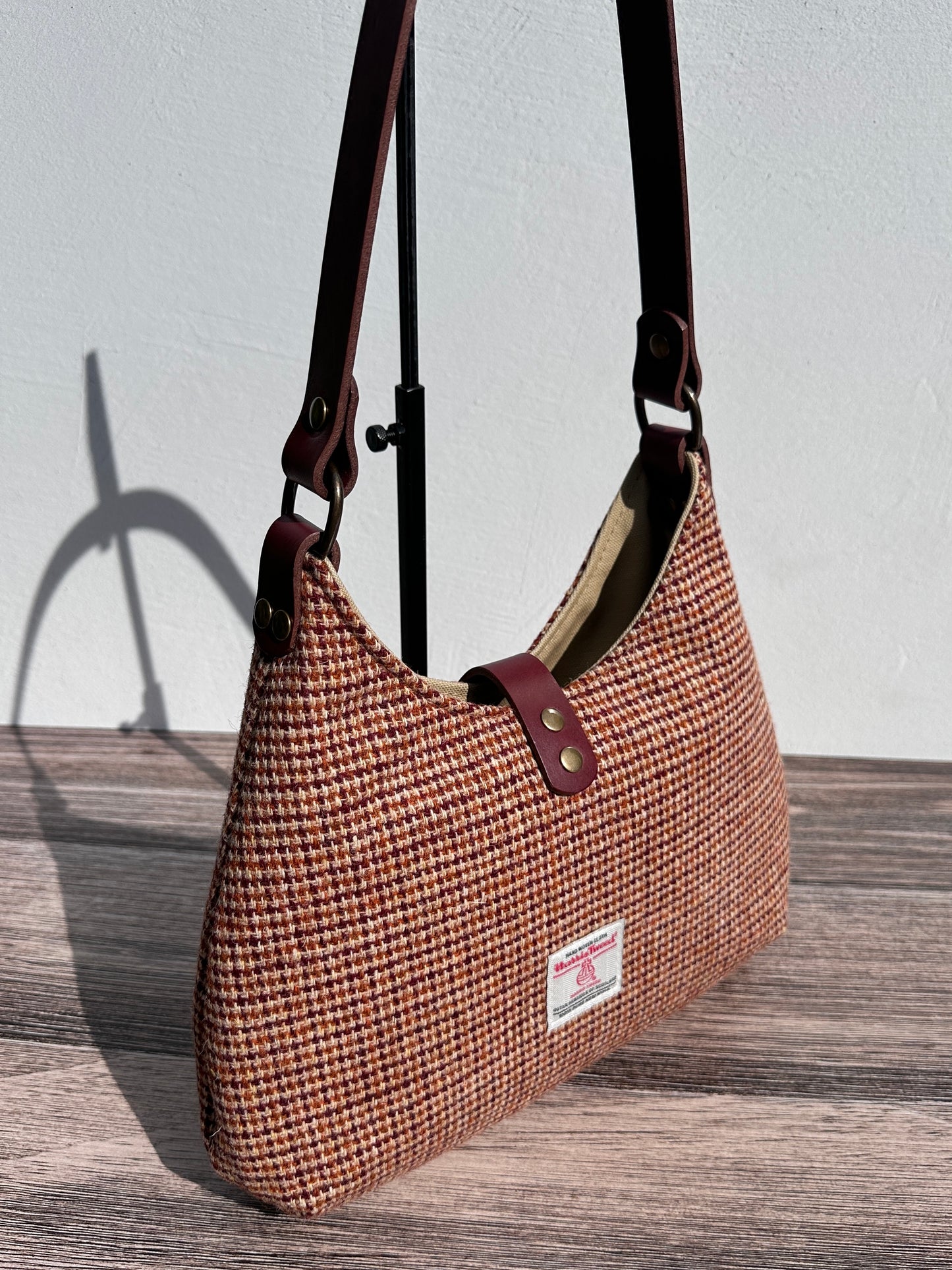 Back view Fawn & Amber Harris Tweed® Rhode River Shoulder Bags, Bordeaux Leather with Antique Brass Hardware. Handcrafted in Maryland