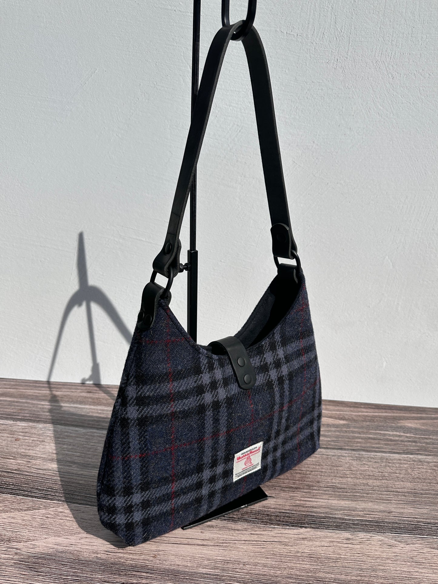 Back view Navy Black & Grey Tartan Harris Tweed® Rhode River Shoulder Bags, Black Leather with Black Matte Hardware. Handcrafted in Maryland