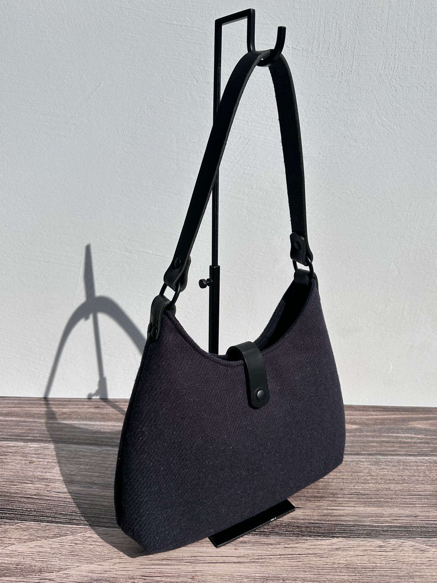 Front view Smoky Grey Harris Tweed® Rhode River Shoulder Bags, Black Leather with Black Matte Hardware. Handcrafted in Maryland