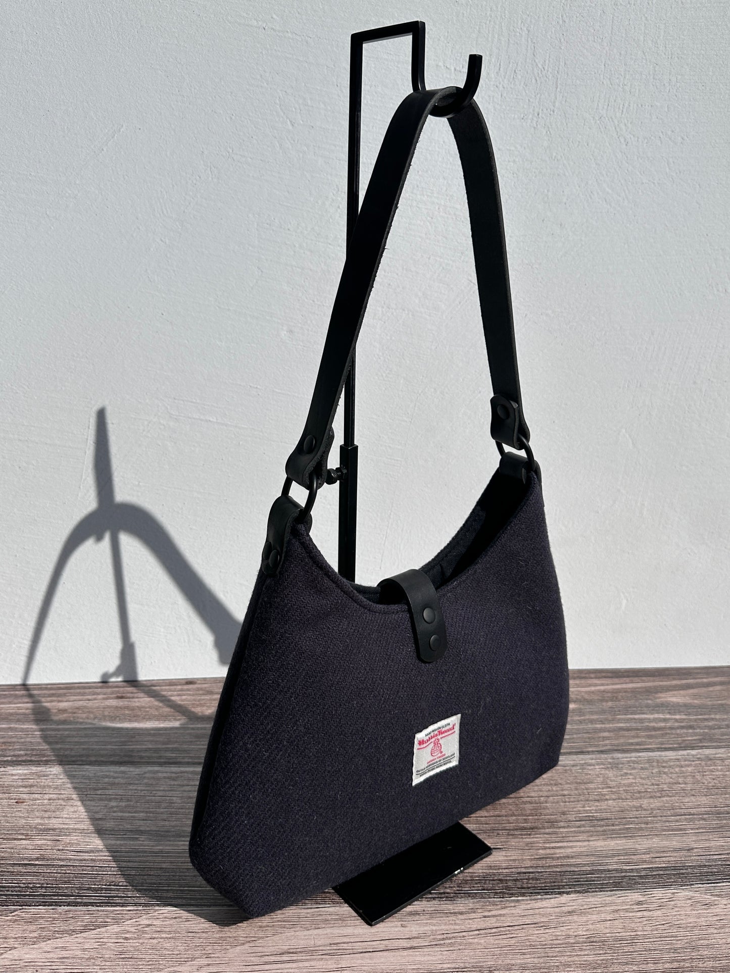 Back view Smoky Grey Harris Tweed® Rhode River Shoulder Bags, Black Leather with Black Matte Hardware. Handcrafted in Maryland