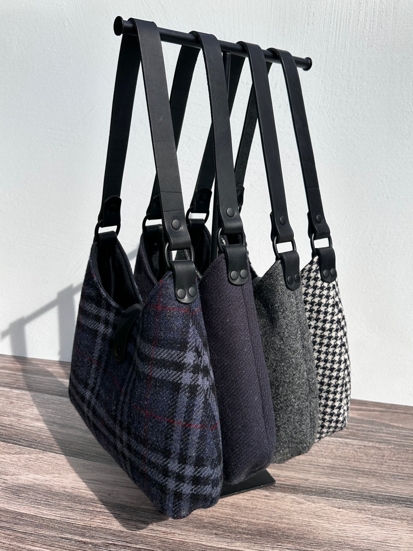 Harris Tweed® Rhode River Shoulder Bags four bags, with different prints and Black Leather and Black Matte Hardware. Handcrafted in Maryland