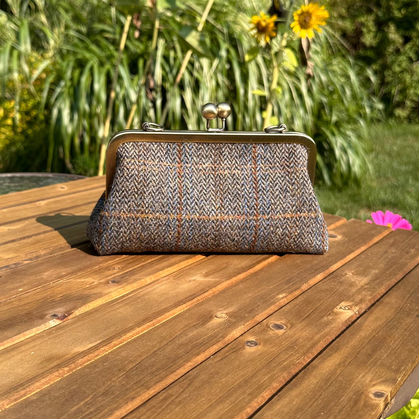 Harris Tweed® kiss lock purse in Green & Blue Herringbone with bronze hardware. Wear as a clutch, attach chain for shoulder or crossbody wear. Holds phone, cards, and small items. Timeless design handcrafted in Maryland.