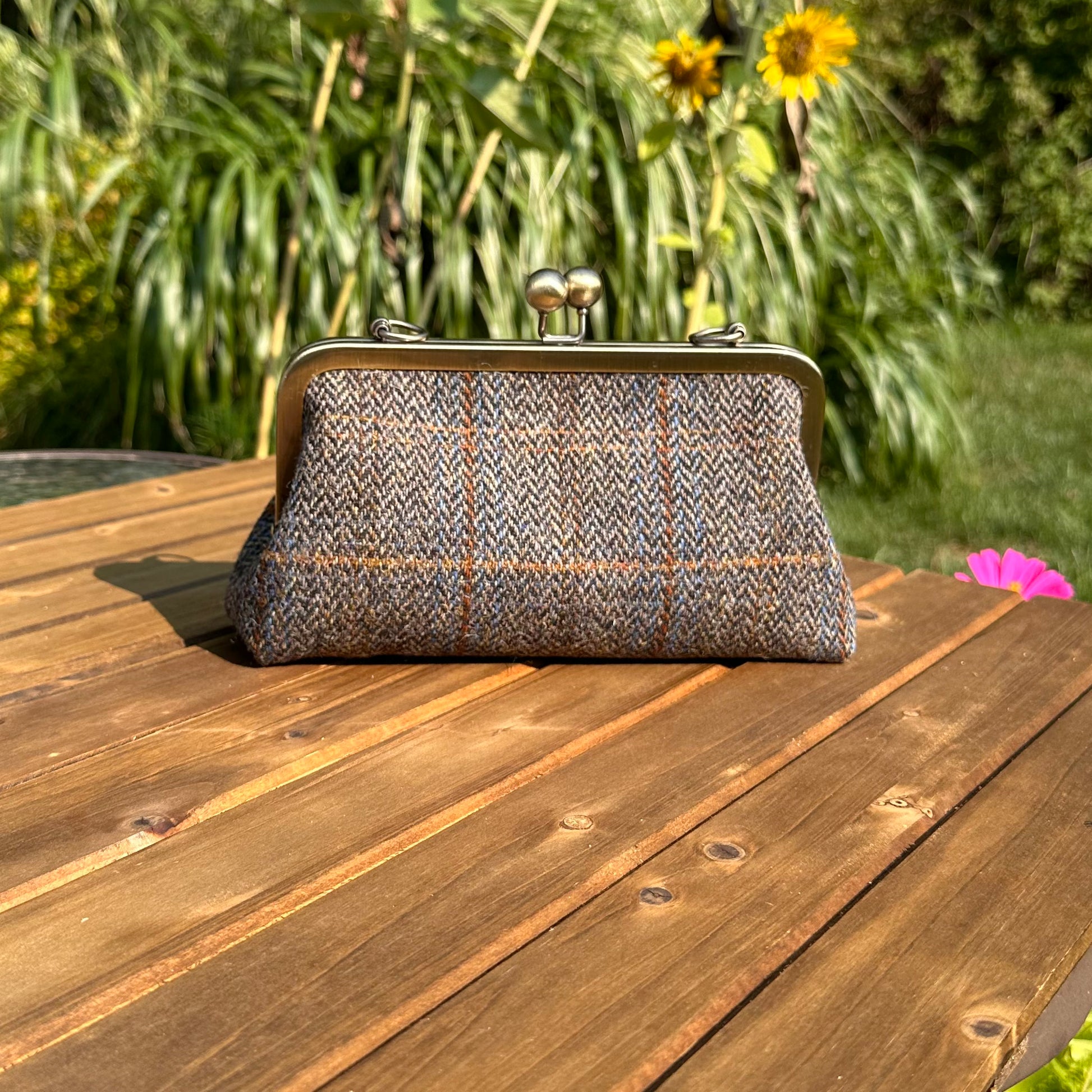 Harris Tweed® kiss lock purse in Green & Blue Herringbone with bronze hardware. Wear as a clutch, attach chain for shoulder or crossbody wear. Holds phone, cards, and small items. Timeless design handcrafted in Maryland.