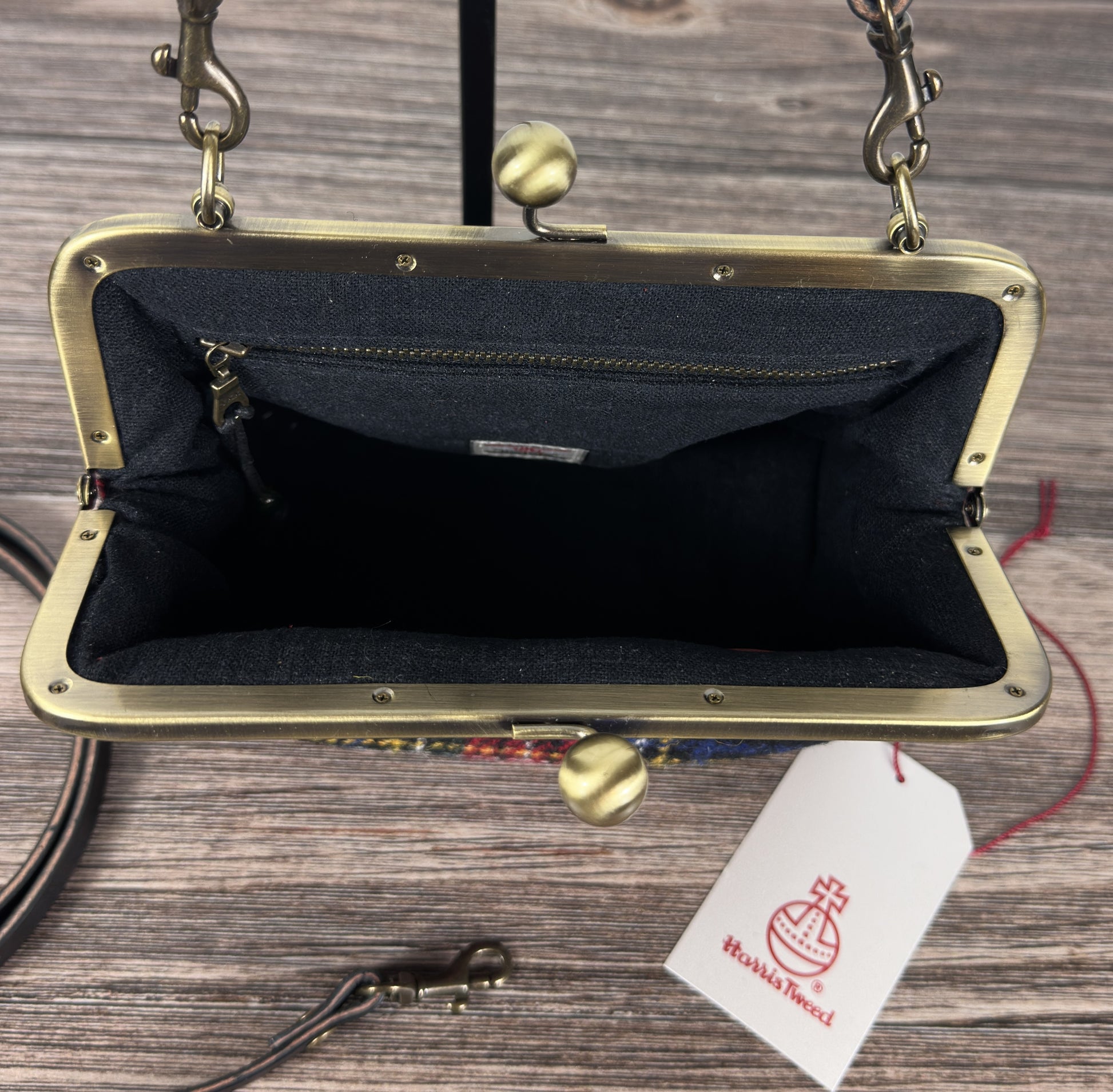 Open view of leather Princess Anne Kiss Lock Purse showing interior zipper pocket and leather card slot pocket — handcrafted in Maryland.
