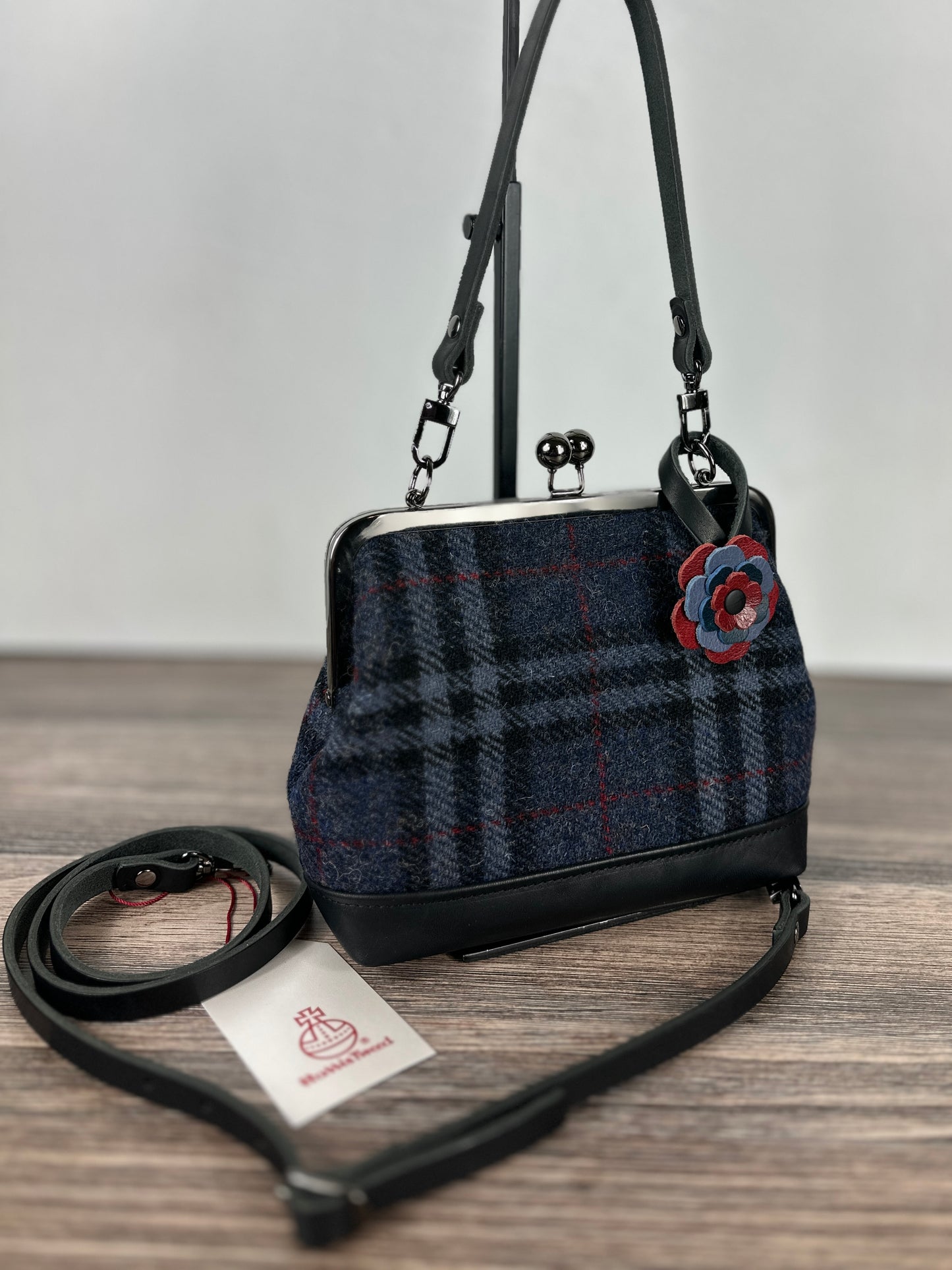 Harris Tweed® Princess Anne Kiss Lock Purse in Navy Grey and Black Plaid with leather base, handbag strap, and crossbody strap — handcrafted in Maryland.