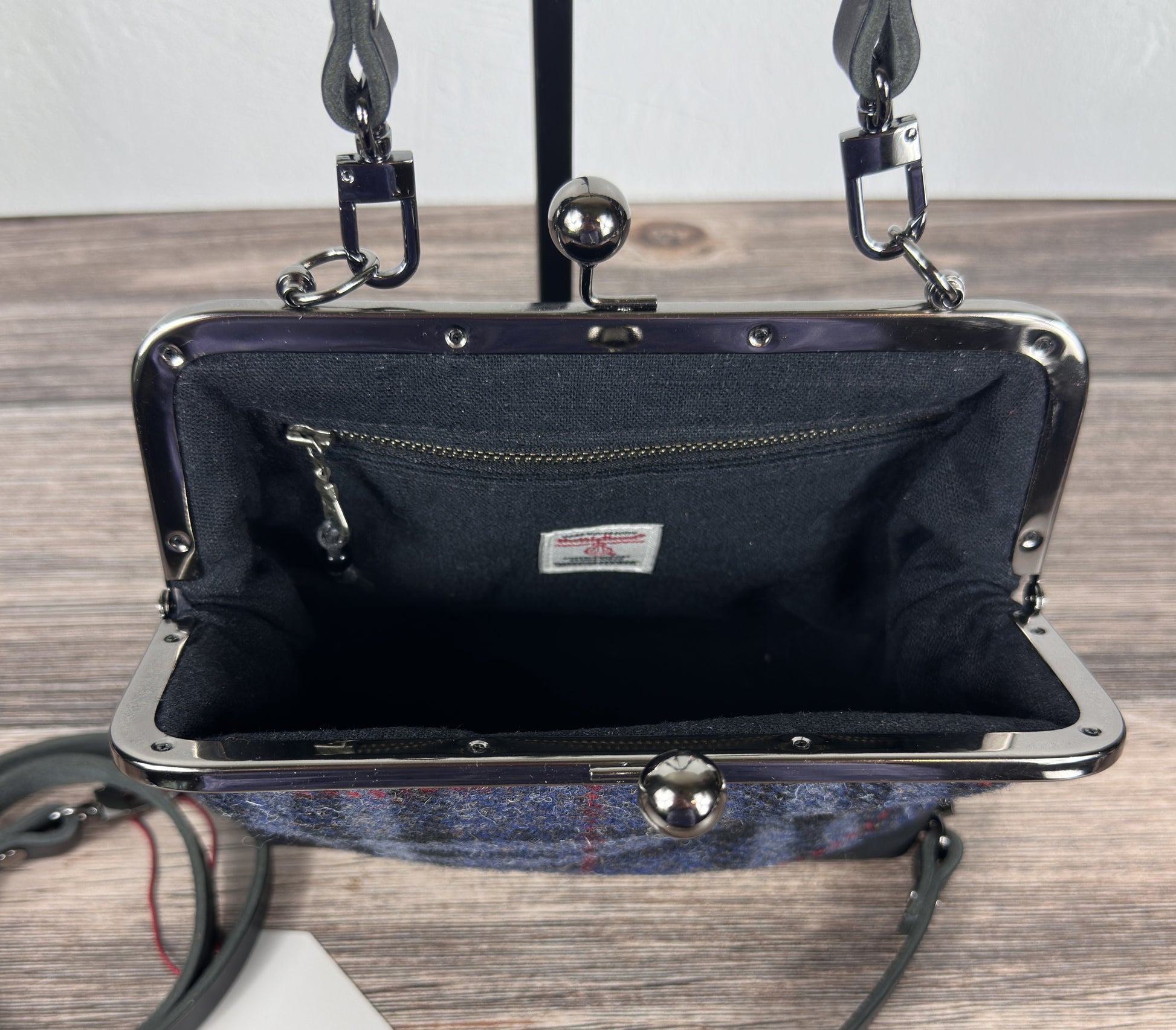 Open view of leather Princess Anne Kiss Lock Purse showing interior zipper pocket and leather card slot pocket — handcrafted in Maryland.