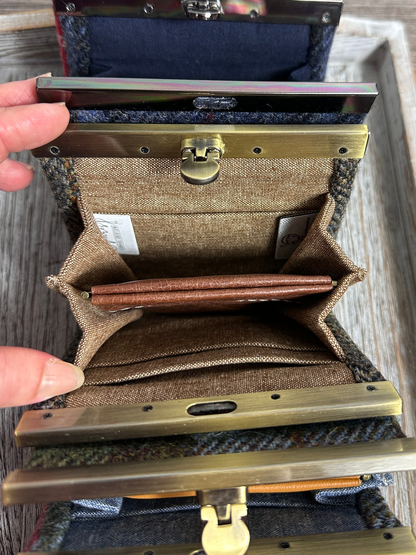 Open Mini Harris Tweed® Rock Hall Wallet showing the linen interior, two card slots, and the removable coin pocket in a slim accordion-style design.