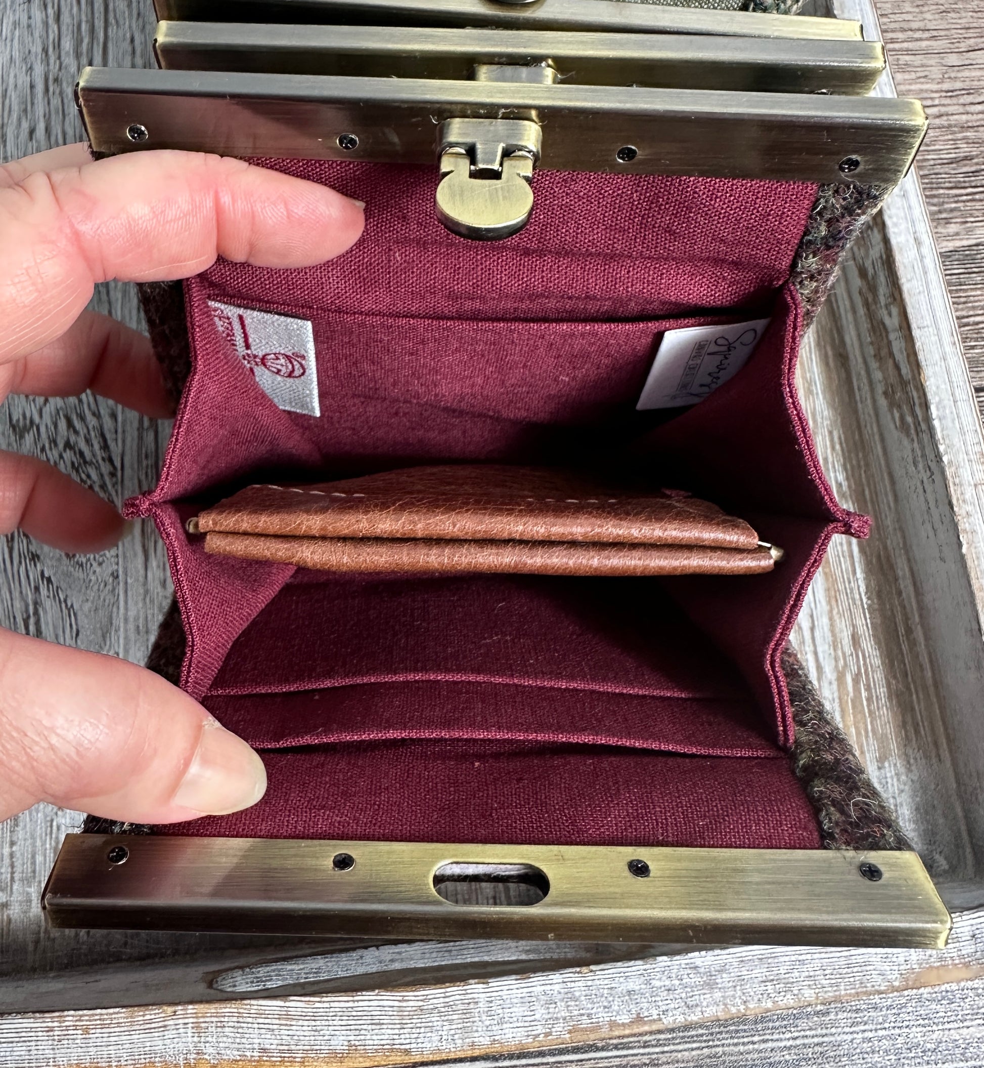 Open Mini Harris Tweed® Rock Hall Wallet showing the linen interior, two card slots, and the removable coin pocket in a slim accordion-style design.