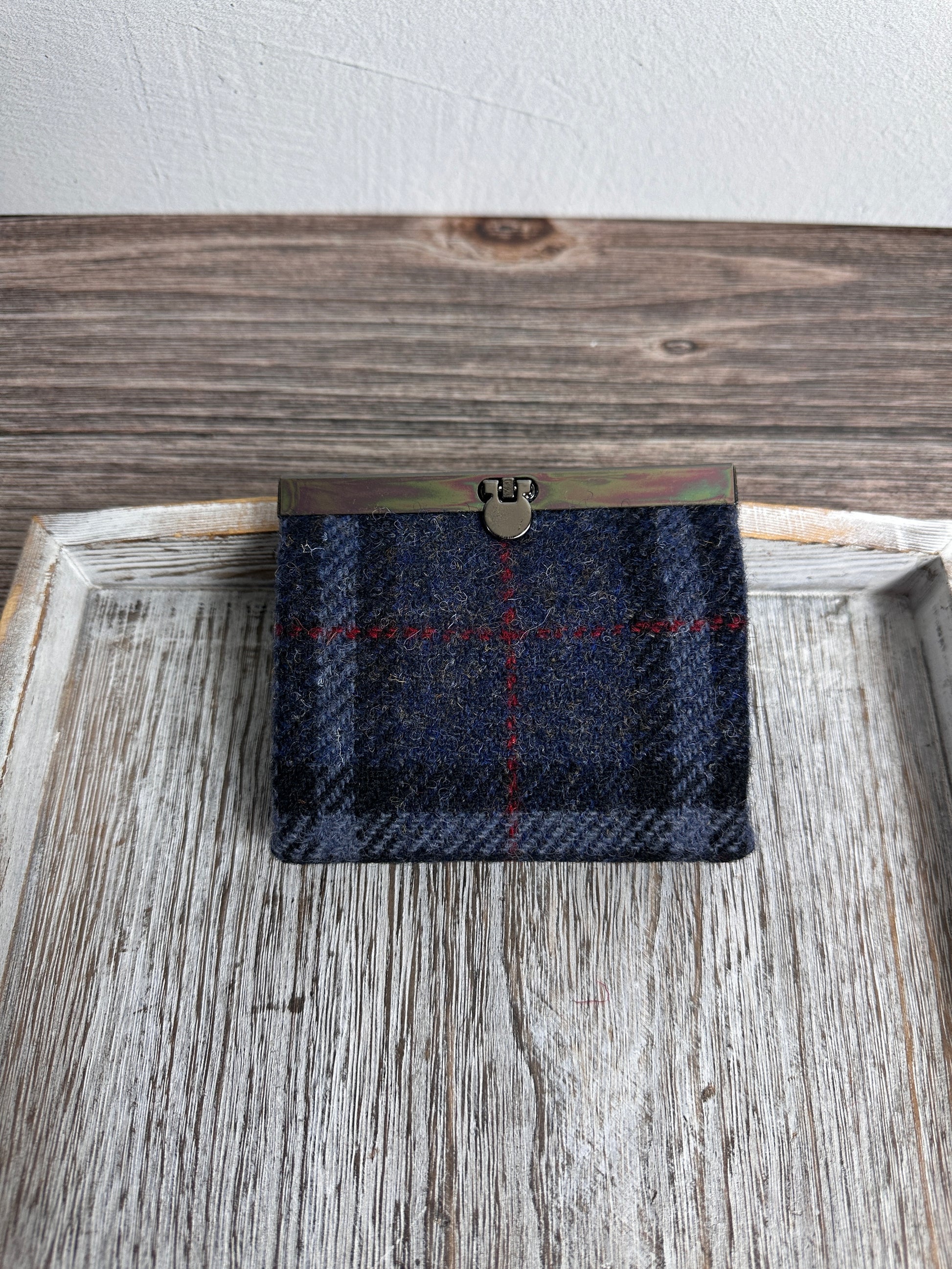 Closed Mini Harris Tweed® Rock Hall Wallet in Dark Navy, Grey, Black Plaid, featuring Gunmetal flip-lock closure.