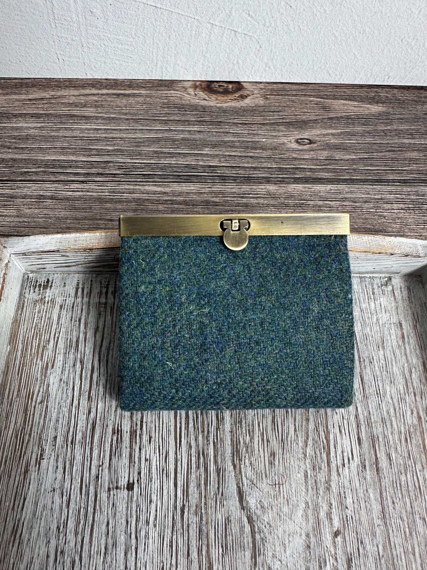 Closed Mini Harris Tweed® Rock Hall Wallet in Teal Twill, featuring Antique Brass flip-lock closure.