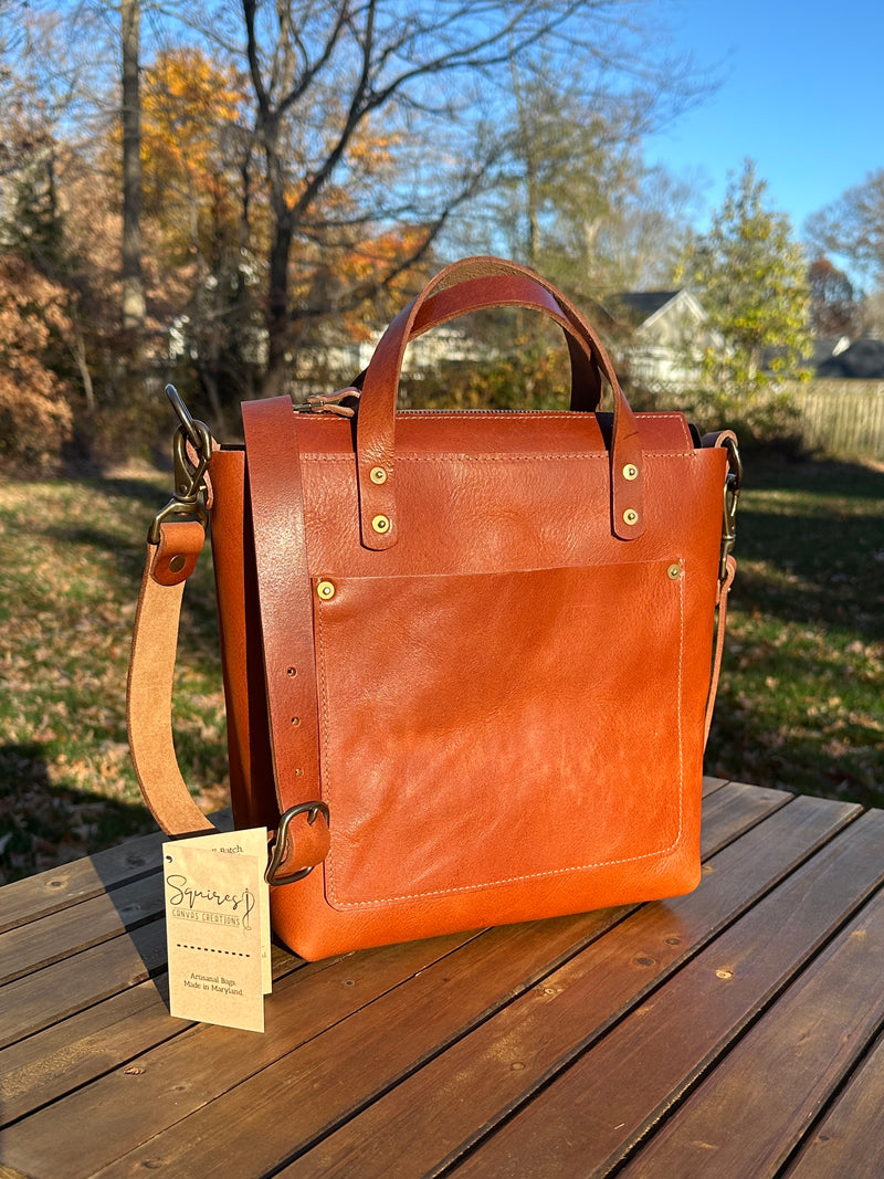 Front view of the Cherry West Street Crossbody bag made with vegetable-tanned leather.