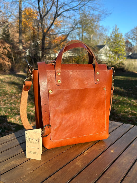 Front view of the Cherry West Street Crossbody bag made with vegetable-tanned leather.