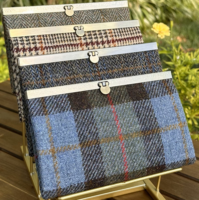 Collection of structured Large Harris Tweed® Rock Hall Wallets, all featuring the slim accordion design and sleek metal flip-lock hardware.