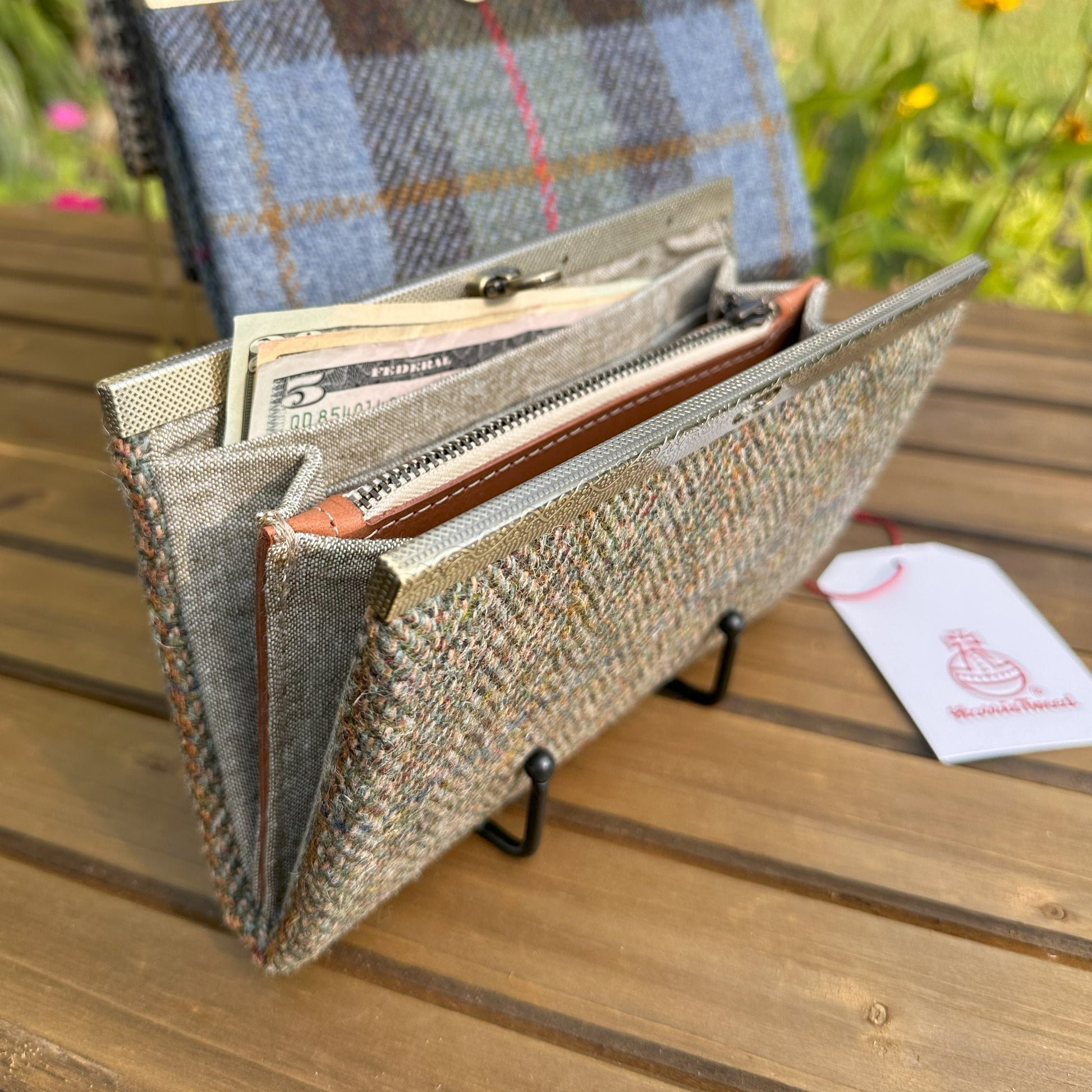 Interior view of the open Harris Tweed® Large Rock Hall Wallet, highlighting the organization features: card slots, cash slip pocket, and leather zipper coin pouch.SquiresCanvasCreations.com