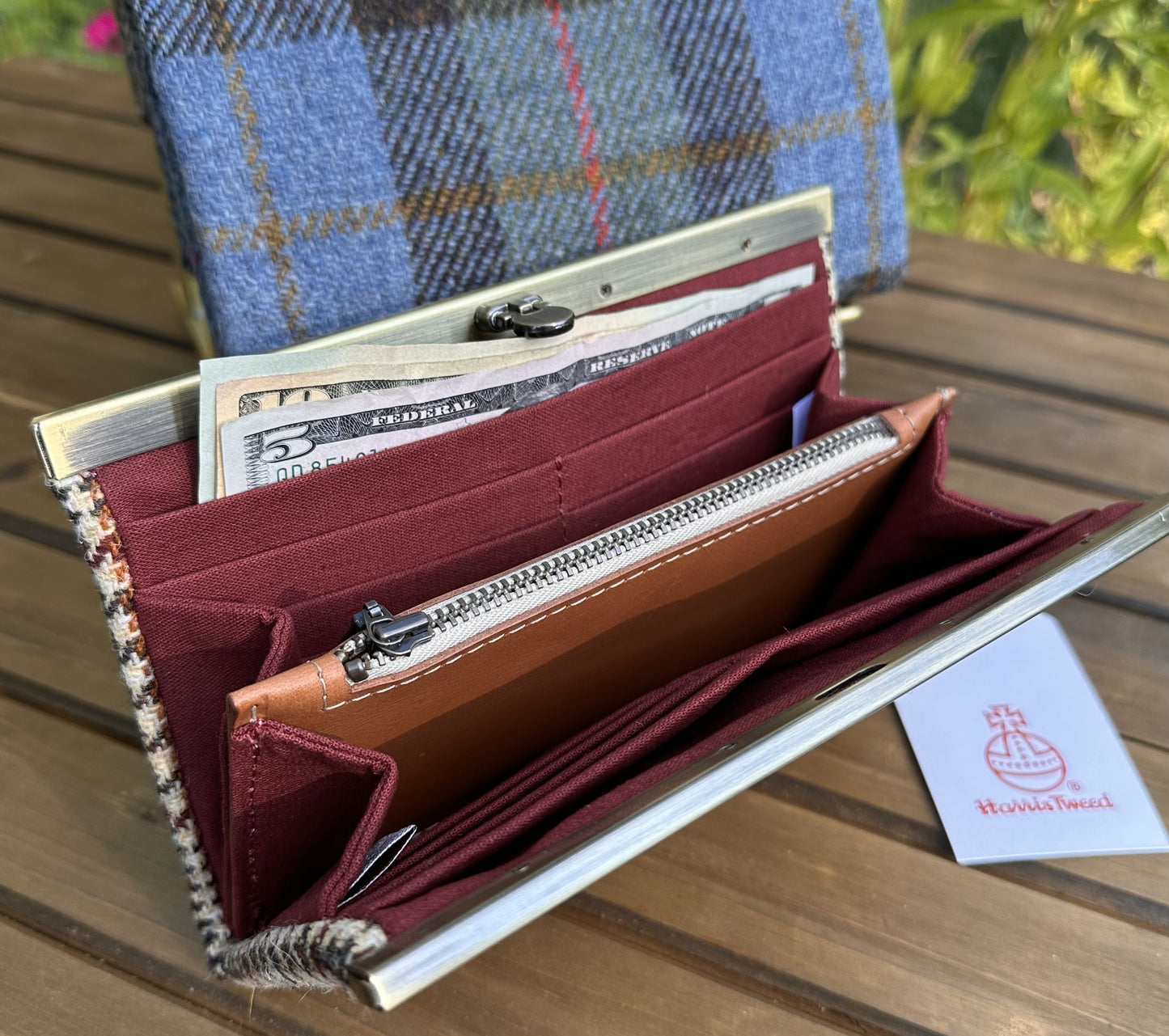 Interior view of the open Harris Tweed® Large Rock Hall Wallet, highlighting the organization features: card slots, cash slip pocket, and leather zipper coin pouch.