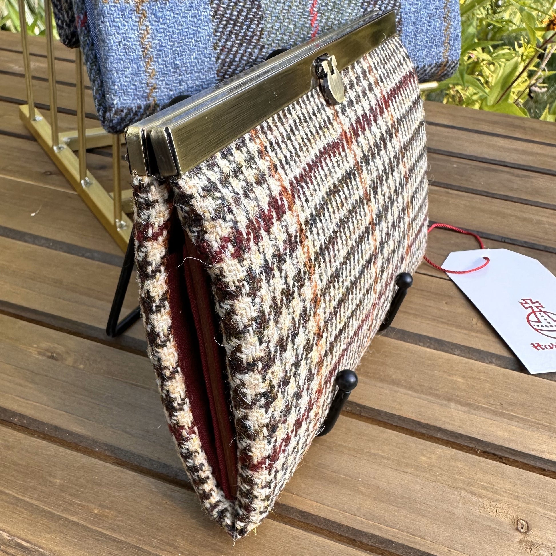Glen Plaid Harris Tweed® Rock Hall Wallet Close-up of the wallet's structured side profile, emphasizing the flexible accordion design which allows the compact Rock Hall Wallet to expand slightly when full.