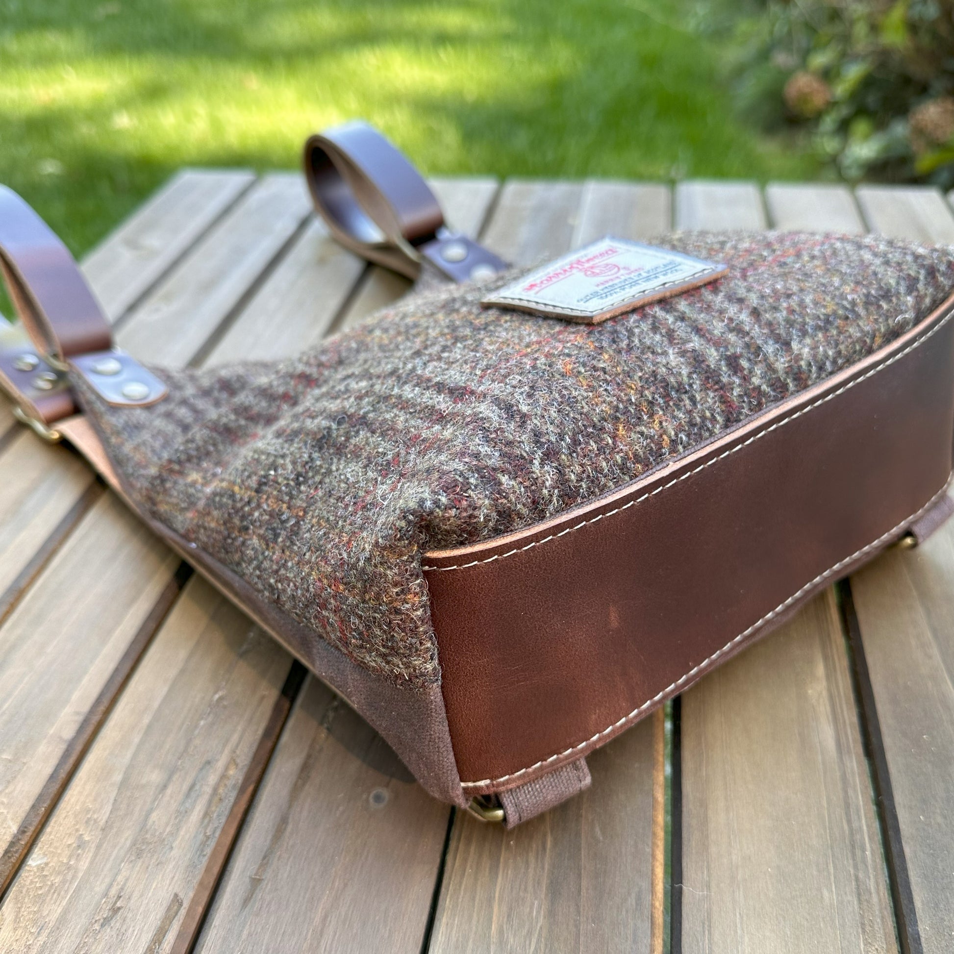 Dark Brown Plaid Harris Tweed® and Dark Brown Waxed Canvas back with Solid Brass Hardware Harris Tweed® Eastport Backpack squirescanvascreations.com