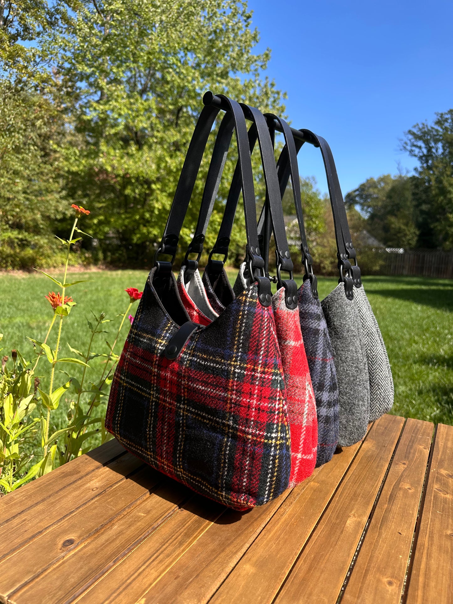 Harris Tweed® Rhode River Shoulder Bags five bags, with different prints and Black leather combos paired with black matte Hardware. Handcrafted in Maryland