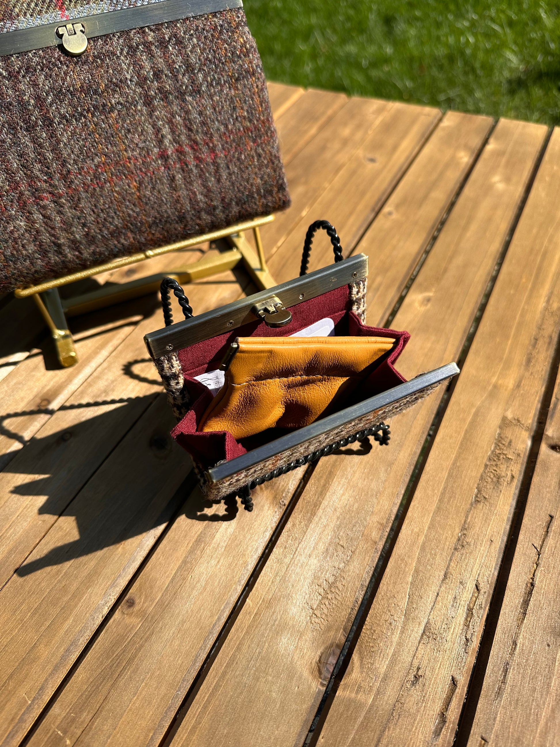 Open Mini Harris Tweed® Rock Hall Wallet showing the linen interior, two card slots, and the removable coin pocket in a slim accordion-style design.