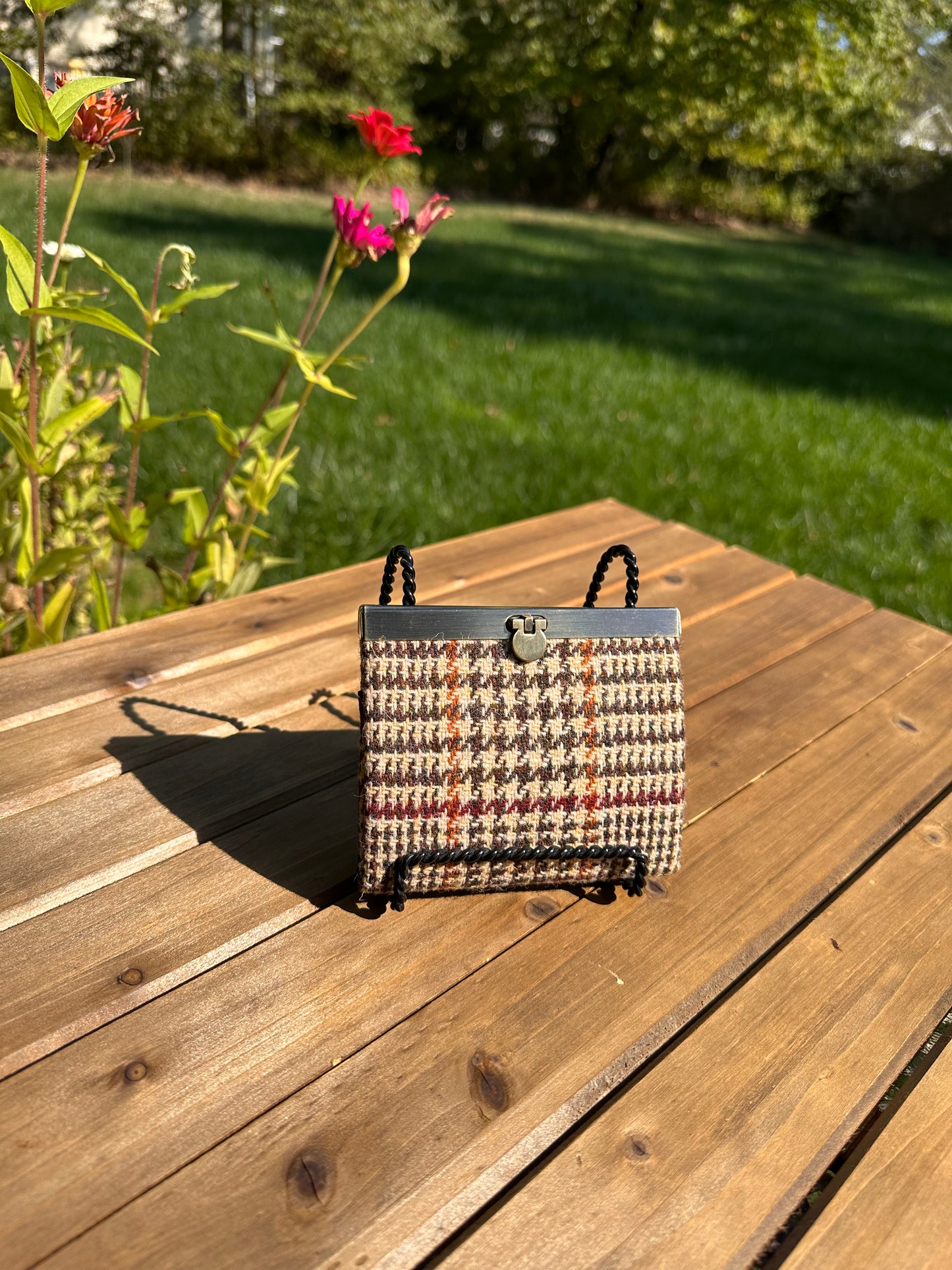 Closed Mini Harris Tweed® Rock Hall Wallet in Glen Plaid, featuring Antique Brass flip-lock closure.