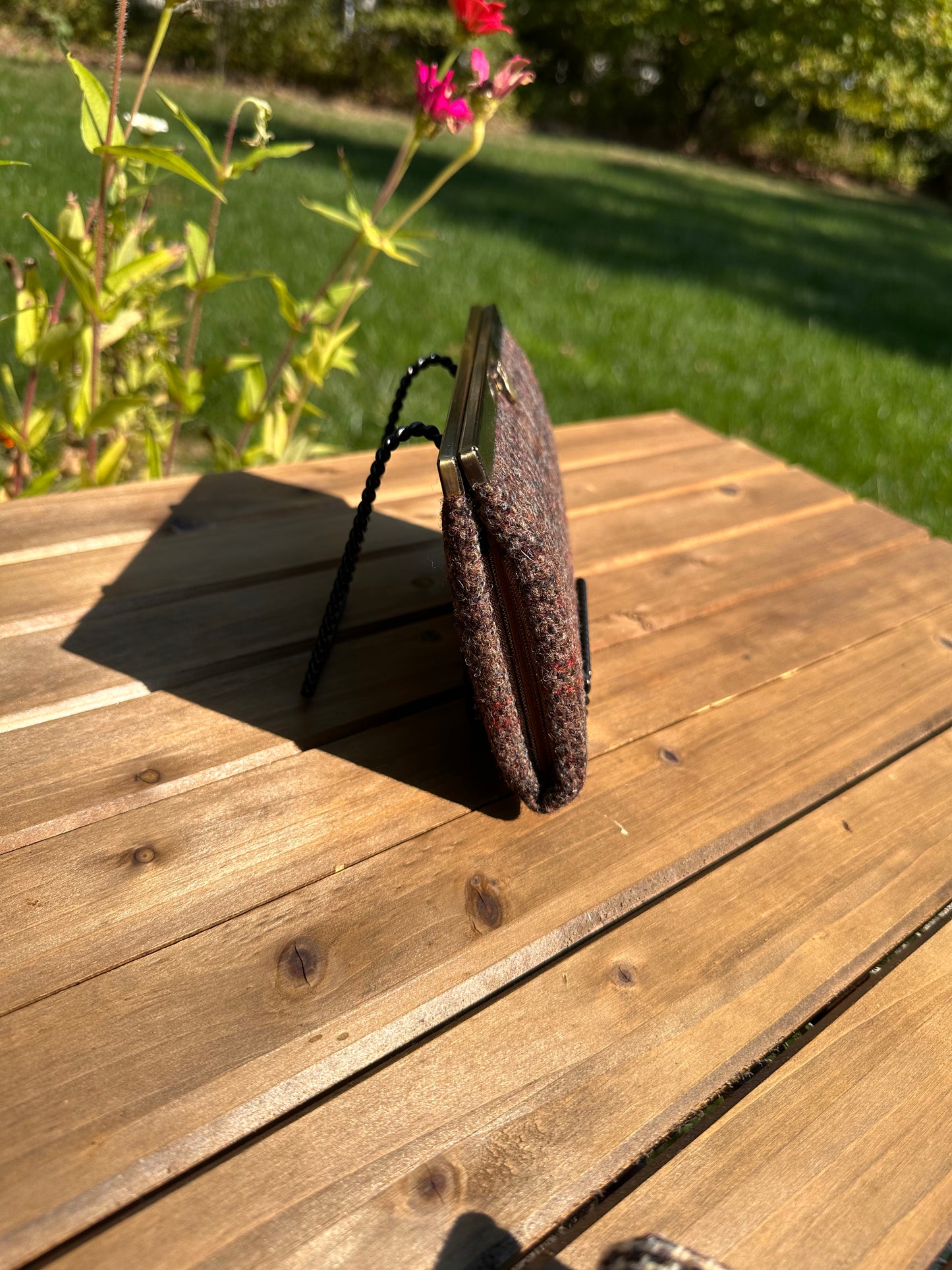 Close-up of the wallet's structured side profile, emphasizing the flexible accordion design which allows the compact Rock Hall Wallet to expand slightly when full.