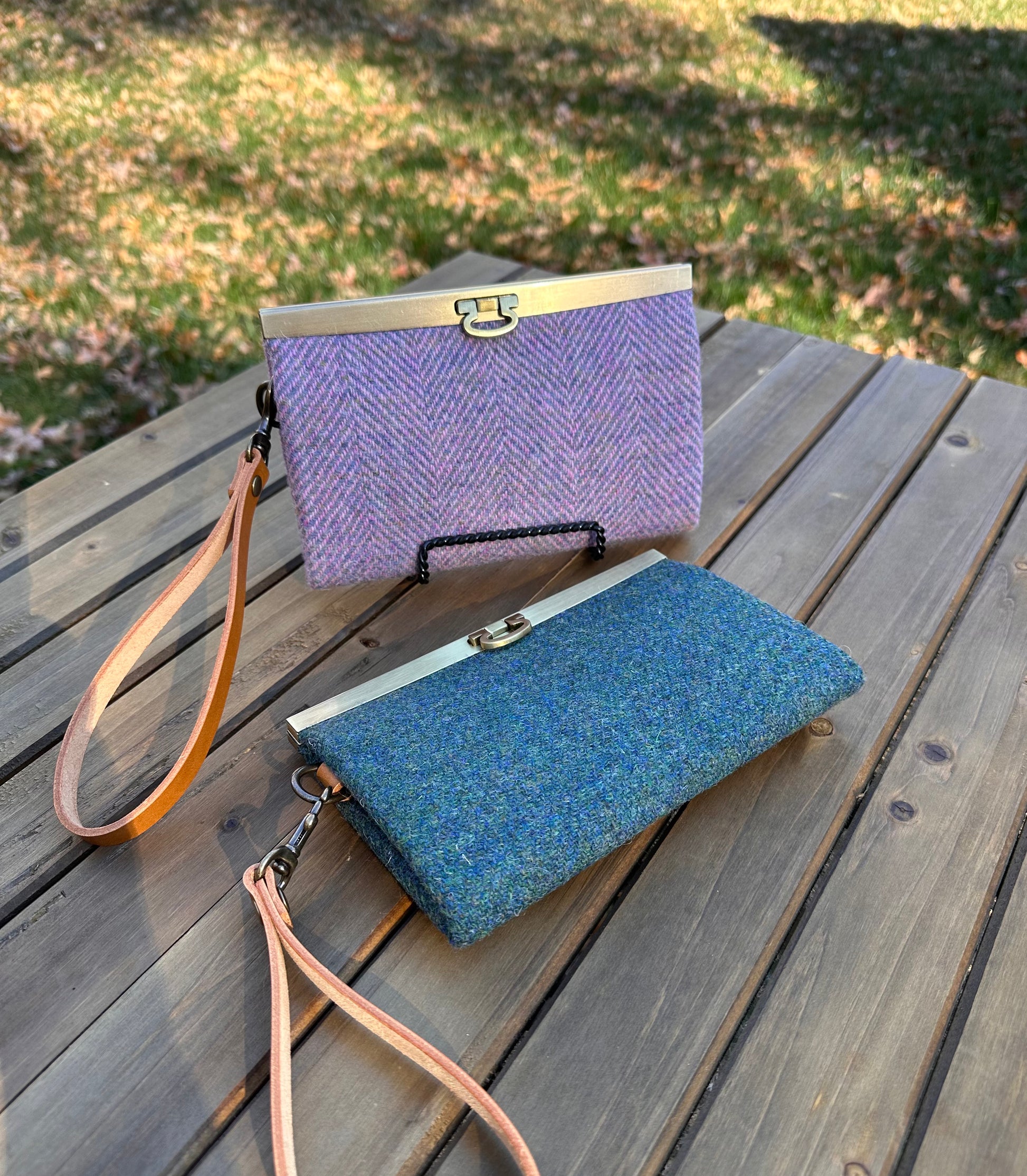 Collection of structured Large Harris Tweed® Rock Hall Wallets, all featuring the slim accordion design and sleek metal flip-lock hardware.