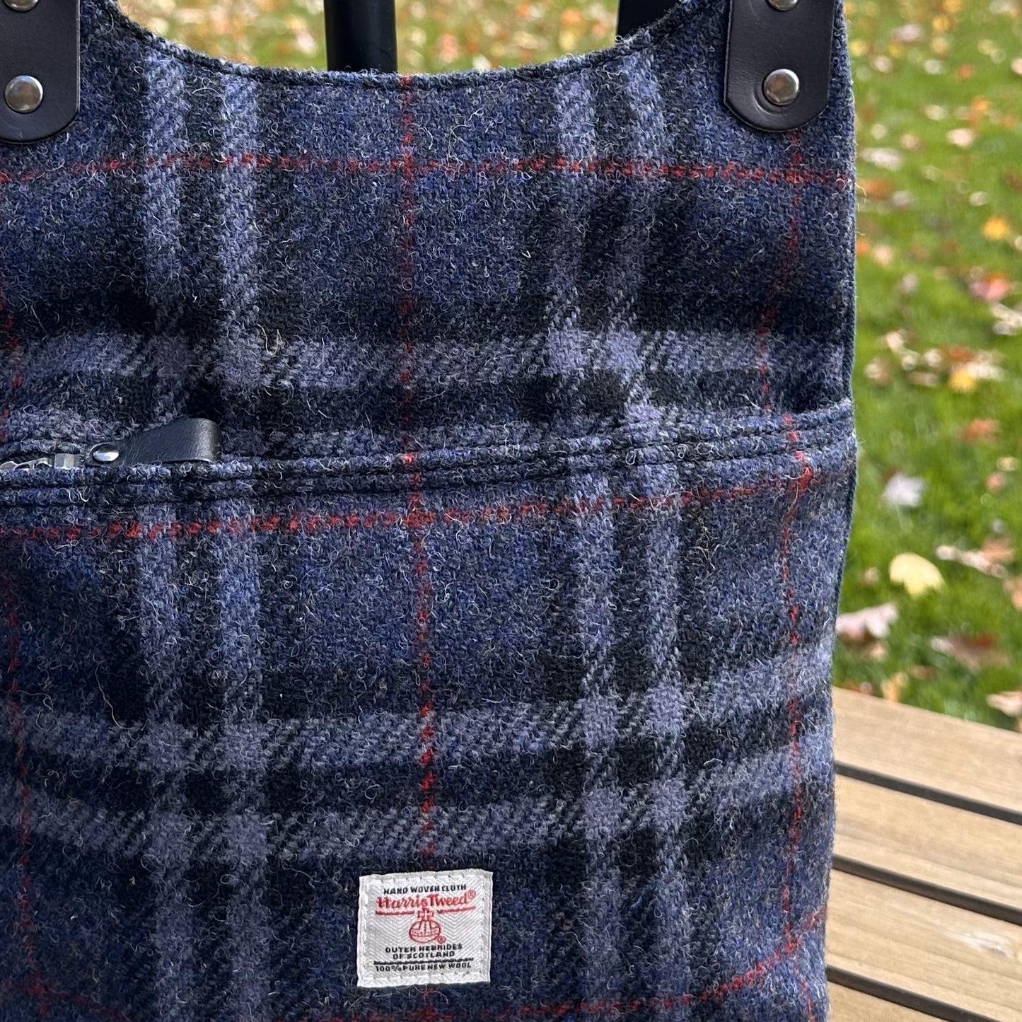 Blue Black and Grey Tartan with Red Overcheck Harris Tweed® and Dark Navy Waxed Canvas back with Solid Brass Hardware Harris Tweed® Eastport Backpack squirescanvascreations.com