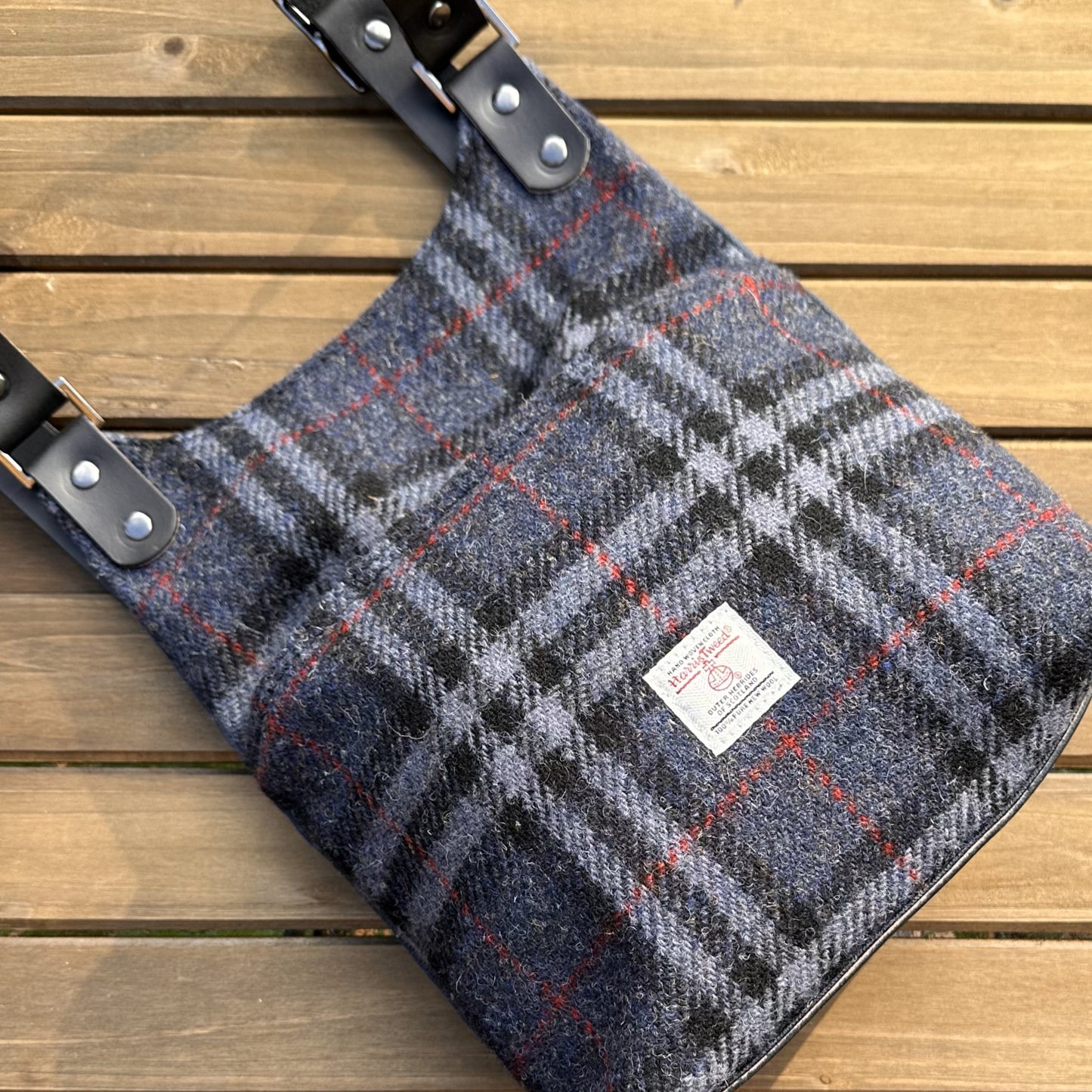 Blue Black and Grey Tartan with Red Overcheck Harris Tweed® and Dark Navy Waxed Canvas back with Solid Brass Hardware Harris Tweed® Eastport Backpack squirescanvascreations.com
