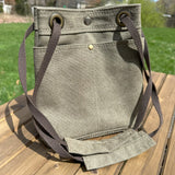 Olive Drab Stone Washed Canvas with and Antique Brass Hardware and Dark Brown Webbing Strap and Natural Canvas interior Spa Creek Bucket Convertible Bag squirescanvascreations.com