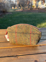 The Seashell Pouch in Green Twill  Harris Tweed® has a curved top and flat base that stands up on its own, lined with natural heavy canvas.