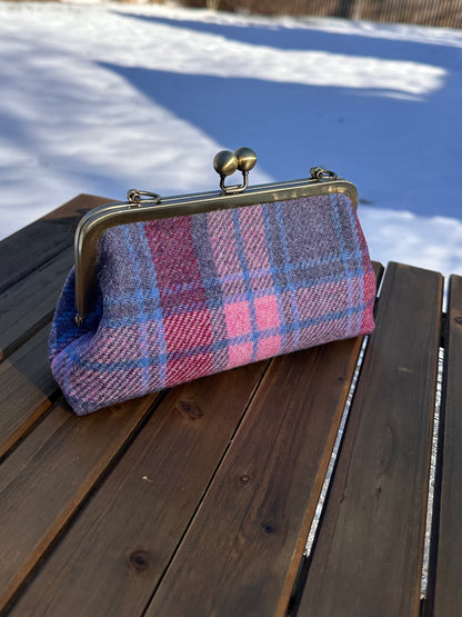 Harris Tweed® kiss lock purse in Pink and Blue Plaid with bronze hardware. Wear as a clutch, attach chain for shoulder or crossbody wear. Holds phone, cards, and small items. Timeless design handcrafted in Maryland. 