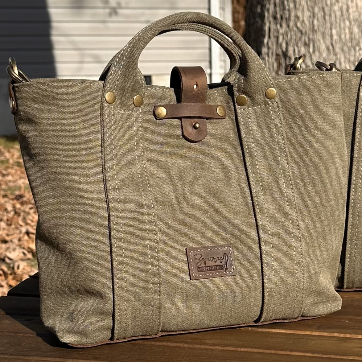 Olive Drab Stone Washed Canvas and Crazy Horse Tan leather with Antique Brass Rivets Waterman Crossbody Tote squirescanvascreations.com