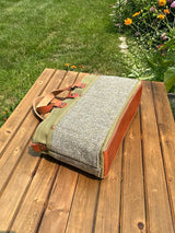 St. Andrews Harris Tweed® Tote,  laying on side, highlighting the Green Blue Barleycorn Harris Tweed® and leather base. Made in MD