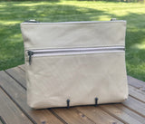 Front View Handcrafted Canvas Bayside Slim Crossbody Bag in linen color canvas with cotton canvas lining and adjustable Splenda vegetable-tanned leather strap. Lightweight and perfect for everyday wear.