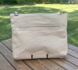 Back View Handcrafted Canvas Bayside Slim Crossbody Bag in linen color canvas with cotton canvas lining and adjustable Splenda vegetable-tanned leather strap. Lightweight and perfect for everyday wear.