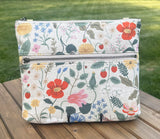 Front View Handcrafted Rifle Paper Co. Canvas Bayside Slim Crossbody Bag in Natural Strawberry Fields Canvas with cotton canvas lining and adjustable Splenda vegetable-tanned leather strap.