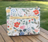 Back View Handcrafted Rifle Paper Co. Canvas Bayside Slim Crossbody Bag in Natural Strawberry Fields Canvas with cotton canvas lining and adjustable Splenda vegetable-tanned leather strap.